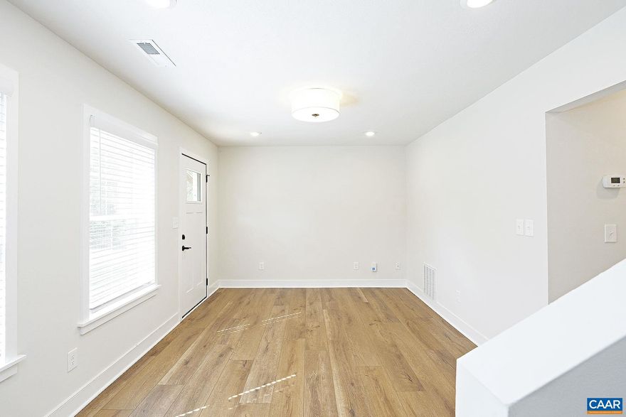 Move-in Ready in Belmont! This recently renovated, move-in ready 3 bedroom, 1.5 bath townhome is nestled in one of Charlottesville?s most beloved neighborhoods. Located in the vibrant Belmont community, this home perfectly blends modern finishes with unbeatable convenience.  Step outside your front door and find yourself just blocks from some of Charlottesville?s best dining spots, including MAS, Tavola, The Local, Mockingbird, and Belle. Attend a concert at the Ting Pavilion, or stroll along the downtown mall, where you'll find an array of restaurants, boutiques, and performance venues. The home is just steps from Summit Elementary and a short drive to UVA Medical Center, 5th St Station, the Rivanna River, and I-64 access.  This 1,330 sqft residence features a light-filled interior with luxury vinyl plank flooring throughout. The main level offers a comfortable living room, a spacious eat-in kitchen with quartz counters and ss appliances, a laundry room with washer and dryer included, and a convenient half bath. Upstairs, you'll find a primary bedroom, two additional bedrooms, and a full bath. Street parking is available right out front. One full-grown dog (50lbs max) is allowed with fees. No cats.