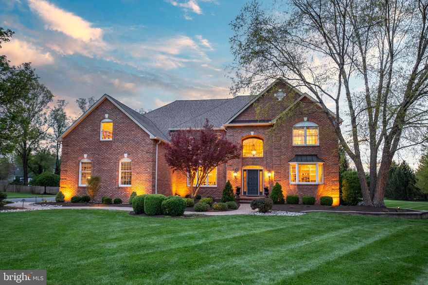 Welcome to 3 Cavallo Way- This impeccably maintained custom-built Pisani home offers over 6,000 square feet of thoughtfully designed living space- spacious and integrated, featuring 4 bedrooms, 5 bathrooms, and a prime location overlooking the long distance views of the reservoir/ Bucks County hike and bike trails, and just minutes from all that Doylestown has to offer.

Step into the grand foyer, where sophistication greets you at every turn. The living room—currently used as a private office—and a formal dining room flank the entrance. The open concept with soaring heights  Family Room stuns with floor-to-ceiling windows, a gas fireplace, and streams of natural light, while the overhead balcony adds an architectural statement. The gourmet kitchen is a chef’s dream with granite countertops, a stone backsplash, stainless steel appliances,  Thermador gas cooktop with downdraft, a full-size Sub-Zero refrigerator/freezer, double KitchenAid wall ovens, a farmhouse sink, custom signature cabinetry, full pantry , and a sunny breakfast room that opens onto the terrace. A main-level flex room, serving as a guest room, is conveniently located near a powder room and could easily function as a playroom or additional office space.

Upstairs, the serene primary suite features a sitting area, two custom walk-in closets another to keep your shoes organized, and a spa-like bath with radiant heated floors, soaking tub, walk-in stone-tiled shower, and double vanities. A secondary bedroom with an en-suite bath and two additional bedrooms connected by a Jack-and-Jill bath complete the second floor.

The finished basement is an entertainer’s haven, complete with custom stone walls and a custom wet bar, full-size wine fridge, drink fridge, counter seating, and a gas stove with a remote thermostat for extra warmth. Media area and space for recreation, a workout room, and plenty of storage in the unfinished area currently used for golf swings. The basement also includes a half bath (with plumbing for a full bath) and an exterior walkout that brings in natural light.

Additional features include a side entrance mudroom and a separate laundry room , an epoxied 3-car garage, a whole-house Generac generator, all with public sewer and water.Some recent alteration to house include sidewalk redone, driveway repointed with paver edging, exterior steps to side entrance redone, upstairs carpet replaced. 

Outside, the two-acre property is a private retreat. Enjoy the terraced outdoor living area with a stone fireplace, outdoor TV, and peaceful views. The beautifully landscaped grounds include a fenced garden, access to park trails, and breathtaking sunsets. Nestled on a quiet cul-de-sac with just eight homes, this residence is part of the highly acclaimed Central Bucks West school district.

Don’t miss the opportunity to experience the lifestyle 3 Cavallo Way has to offer—schedule your private tour today!