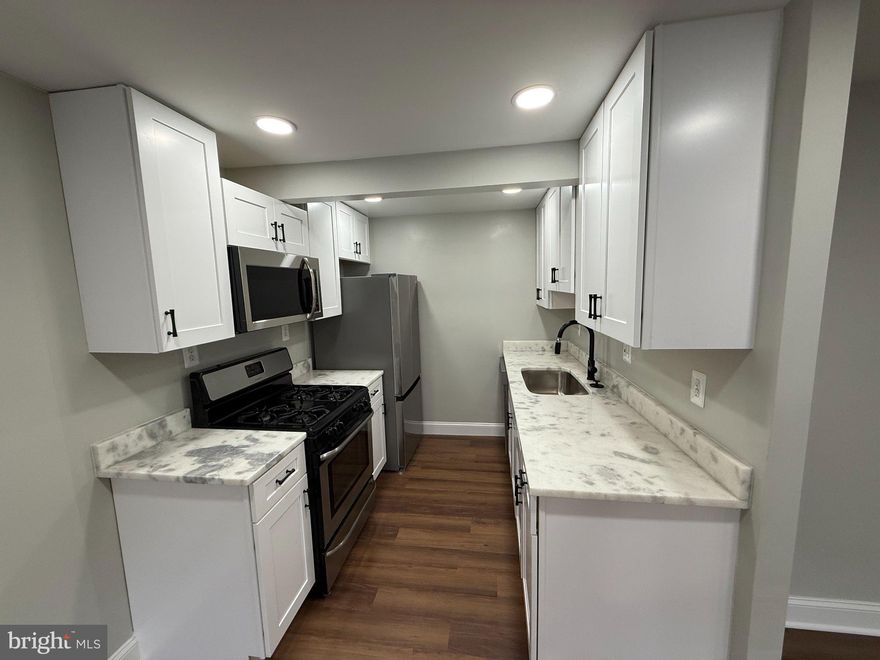 Best value in Prince George’s County! Welcome to this beautifully updated home in the highly sought-after Windmill Square Village Condo Phase 8 community. Renovated with exceptional attention to detail, this home perfectly blends modern style with everyday comfort.

The stunning gourmet kitchen features premium quartz countertops, stainless steel appliances, and an oversized double-wide sink — ideal for cooking and entertaining. Luxury vinyl plank flooring flows throughout the home, complemented and abundant recessed lighting that creates a bright, contemporary feel.

Don’t miss the charming sunroom — the perfect space to enjoy your morning coffee, unwind after a long day, or share a relaxed meal with family and friends. Conveniently located just minutes from Washington, DC, this home offers both comfort and accessibility in an unbeatable location.