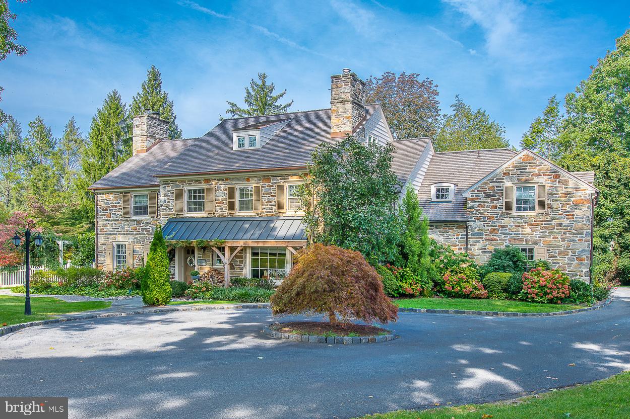 Stunning, stone, Main Line colonial on a private lane in one of Haverford's most coveted neighborhoods. This beautiful property features lovely architectural details, well-proportioned sun-lit rooms and attractive landscaped grounds with a beautiful pool and outdoor entertaining spaces. First Floor: large welcoming entrance hall with elegant staircase; living room with wood-burning fireplace and doors to patio; dining room with bay window; den/study with gas fireplace, bay window and built-in cabinetry; fabulous addition designed by Gardner Fox featuring a well-equipped kitchen with plentiful custom cabinetry open to breakfast room and family room with gas fireplace and doors to brick patio overlooking the secluded pool; formal powder room. Second Floor: luxurious primary bedroom suite with bathroom and large his and hers walk-in closets; bedroom 2 with private bathroom; bedroom 3 with jack-and-jill bathroom to bedroom 4. Third Floor: bedroom 5 with window seat; bedroom 6; hall bathroom. Lower Level (which offers an additional approximately 1,000 sq ft of living space): second family room with wood-burning fireplace; temperature-controlled wine room; laundry room; gym; second powder room, unfinished area used for storage and a workshop. This exceptional property is conveniently located for Merion Country Club and the shops of Haverford and is within an easy commute to Center City and Manhattan.