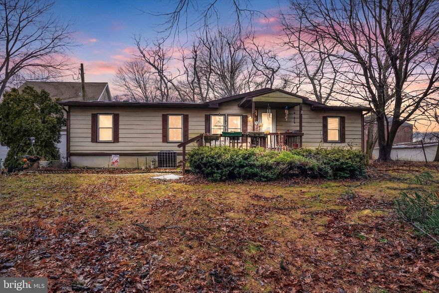 This charming, thoughtfully maintained and updated manufactured home situated on a level, 1/2 acre lot has something to delight everyone on your list! The 4 bed, 2 bath residence sits on a permanent block foundation, and boasts all new windows, new furnace and central AC, a completely new plumbing system, new flooring throughout, plus new subfloors in several rooms, adding comfort, energy savings and peace of mind. The open layout offers a gorgeous new kitchen with quartz counters, tile backsplash,  upgraded bar sink and ample cabinetry, large living room and open dining room with vaulted ceilings, and a handy laundry room off the kitchen. Generous bedrooms include a primary suite with walk-in closet and renovated primary bath with double vanity and a gorgeous oversized custom tile shower with built-in seat and handicap equipped. The main bath off the second and third bedrooms has also been updated with new fixtures and finishes and handicap equipped. Enjoy the outdoors on the welcoming front porch or the covered rear deck overlooking the big backyard with uninterrupted views of rolling countryside. The 2-story detached garage has an oversized main level with 2 bays and walk-up stairs to large storage areas above, perfect for tools, toys, work, hobbies or car enthusiasts. Ideally located on the outskirts of Stewartstown, in easy reach of your favorite borough attractions and dining, and within minutes to Shrewsbury, MD Line, shopping areas, schools, parks and more, you can enjoy the best of small town living without sacrificing convenience. Welcome home!