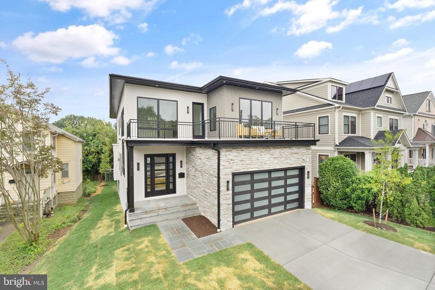 Something Special - new construction in sought after Lyon Park - This stunning contemporary-style residence boasts 6 bedrooms, 6.5 bathrooms, and an attached two-car garage, offering both luxury and convenience. As you step inside, you'll be greeted by an open-concept floor plan that seamlessly blends modern design with craftsman-style finishes. The main level features 10' ceilings, premium oak hardwood floors, and a 42' gas fireplace in the great room, creating a warm and inviting atmosphere. The gourmet kitchen is equipped with stainless steel appliances, quartz countertops, and ample cabinetry for all your culinary needs. With a 2-zone HVAC system and high-efficiency gas water heater, comfort is guaranteed throughout the year. Recessed LED lighting illuminates the home, while a mudroom with bench and cubbies provides practical storage solutions. Step outside to enjoy the covered balcony off the primary bedroom or relax on the rear covered porch, perfect for outdoor entertaining. The finished basement offers additional living space with a modern wet bar and separate wine storage room, ideal for hosting guests or unwinding after a long day. Plus, with convenient access to major commuter routes, the Clarendon Metro, Washington DC, shops, and restaurants, everything you need is just moments away. Don't miss the opportunity to make this your new home.