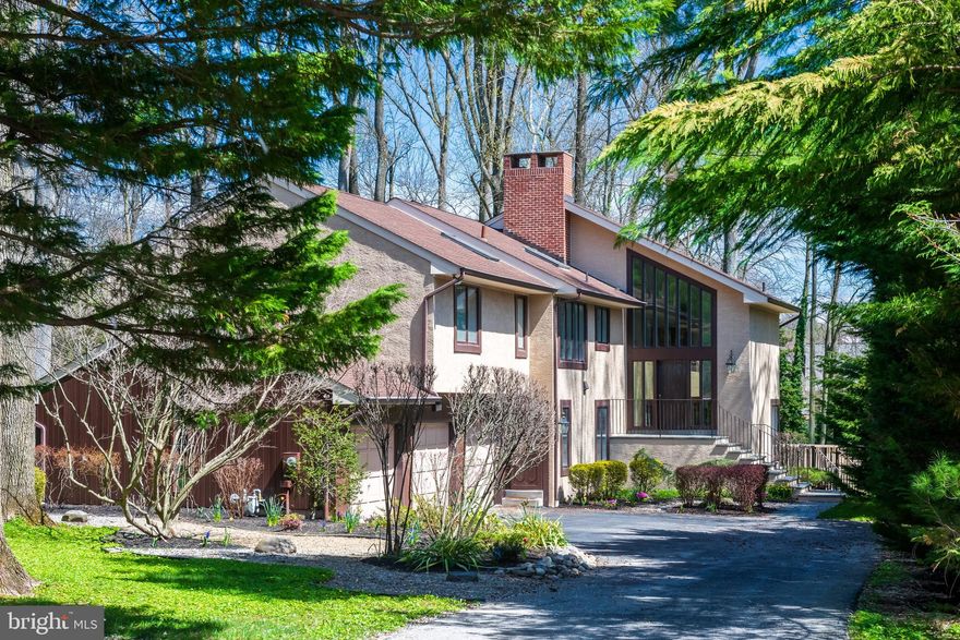 Step into 556 Hoffman Drive, a modern oasis nestled at the end of a peaceful cul-de-sac in Bryn Mawr. This stunning 5/6-bedroom, 3.5-bathroom home has been nurtured and cherished for decades. Originally crafted in 1988 by the inspired hands of the owners, this residence has been more than just a house; it has been a canvas for a family's dreams and memories. In 1996, a meticulously fashioned wine cellar was added, a testament to the appreciation of life's finer pleasures. Three expansive decks were also constructed, extending invitations to gather under the sky's embrace of the beautiful 1.13-acre property. In 2005, the entrance evolved from wooden decking to concrete and flagstone, a prelude to the modern elegance awaiting within. Tall vertical glass windows situated above the front door flood the foyer with natural light. The heart of the home underwent a metamorphosis in 2012, as the kitchen was completely renovated, a culinary haven for the Chef-owner blending function with style. 2014 ushered in a sanctuary of serenity, with the master bedroom windows framing vistas of tranquility. In 2016, a sumptuous, skylit master bathroom was added, beaming in the sunlight or moonlight, depending on the time of day. Three and a half bathrooms were reinvented in 2016. 2017 saw a major improvement, as carpets made way for hardwood on the first floor and timeless parquet floors that are now surging in popularity on the main floor. Simultaneously, a state-of-the-art AC unit added comfort on warm summer days. In 2018, the home breathed easier with the installation of an industrial humidifier, while 2019 fortified its foundations with a new sewage pump, silent guardians ensuring seamless living. A fresh coat of paint in 2023 brought new life to the exterior of the house, twenty-five years, and many memories after its original construction. Most recently, as of February 2024, a brand-new water heater was added, ready to fuel countless moments of warmth in the elegant soaking tub. Bimonthly inspections by Ecoshield Pest Solutions provide peace of mind. While the beautiful lawn, trees, and shrubbery have been nurtured by dedicated caretakers for years, ensuring that every leaf and blade of grass welcomes those who pass through the peaceful cul-de-sac. Perfectly situated in the heart of Northside Bryn Mawr this house boasts top Lower Merion Schools and a bounty of top-rated private schools and universities. The prestigious community of Bryn Mawr includes the renowned Bryn Mawr Hospital, a town center filled with many activities such as music festivals, farmers markets, a film festival, top-notch family-owned restaurants, and, quaint boutique shopping. Welcome home to a fabulous lifestyle in a home that is a legacy of love, labor , with still boundless possibilities -556 Hoffman Drive.