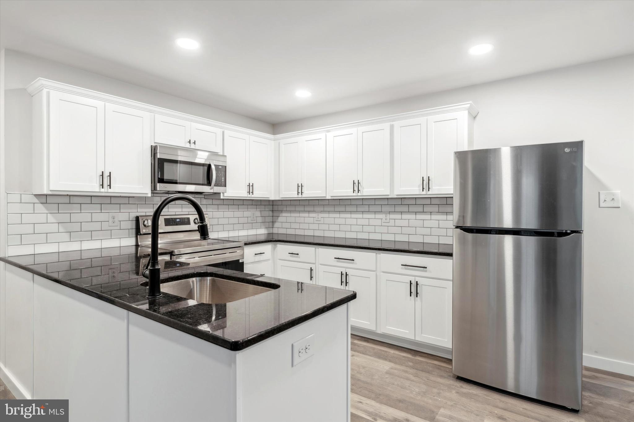 Welcome to 908 E Baltimore Pike in Kennett Square, where modern luxury meets convenient living. This brand-new two-bedroom, two-bathroom apartment is a testament to contemporary design and meticulous construction. As you step inside the unit, you'll be greeted by a spacious and open floor plan that seamlessly connects the living, dining, and kitchen areas, creating an inviting atmosphere filled with natural light. The kitchen features stainless steel appliances, granite countertops, white cabinets, dishwasher, and subway tile backsplash. The primary bedroom offers a large walk-in closet and a modern en-suite bathroom with double sinks, a linen closet, and stylish tile surround bathtub. The second bedroom offers storage and natural light. The second full bathroom is complete with modern fixtures, a spacious vanity, and another stylish tile surround bathtub. The convenience of an in-unit washer and dryer adds to the comfort of daily living. It is also central air and heat.  The apartment complex features onsite parking, a patio for entertaining, and a dog park on site. You'll have easy access to local shops, dining, and entertainment options, making this apartment an ideal choice for those seeking a vibrant and connected lifestyle. Pets on a case by case basis with a $500 non-refundable deposit. Tenants will need to provide vaccination shots, etc. and pictures of animals. Contact us today to schedule a tour and experience the epitome of modern living in Kennett Square!