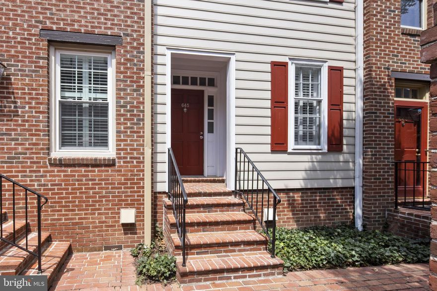 Available for immediate occupancy! Beautifully updated and maintained Arch Hall townhome. Extensive improvements include expanded and fully updated Kitchen to include bright white cabinets (some with glass fronts), high end stainless steel appliances, pantry built ins, and wall removed for incredible main level flow. Main level dining and family room enhanced by fireplace, beautiful hardwood floors, trim detailing, and wall of glass doors/transoms leading to private brick patio. Patio gate leads to highly desirable off street parking lot with 2 spots for this unit. Primary suite upgraded to include custom closet build outs, spa like bath including walk in double head shower, tub, custom vanity, and beautiful tile work throughout. Convenient powder room for guests also fully updated with beautiful "basket weave" tile detail and custom vanity. Flexible top level ideal for bed/guest room, home office, exercise space, etc. Spacious top level full bath and laundry as well as multiple closets. More than ample storage provided by concrete floored crawl space (approximately 4 feet of clearance) accessed through main level coat closet. The ideal combination of an updated and upgraded Old Town townhome with the convenience of low maintenance condo living.  Water, trash, bike storage, and 2 parking spots included in rent payment! Walk to everything Old Town has to offer from this turn key low maintenance home!