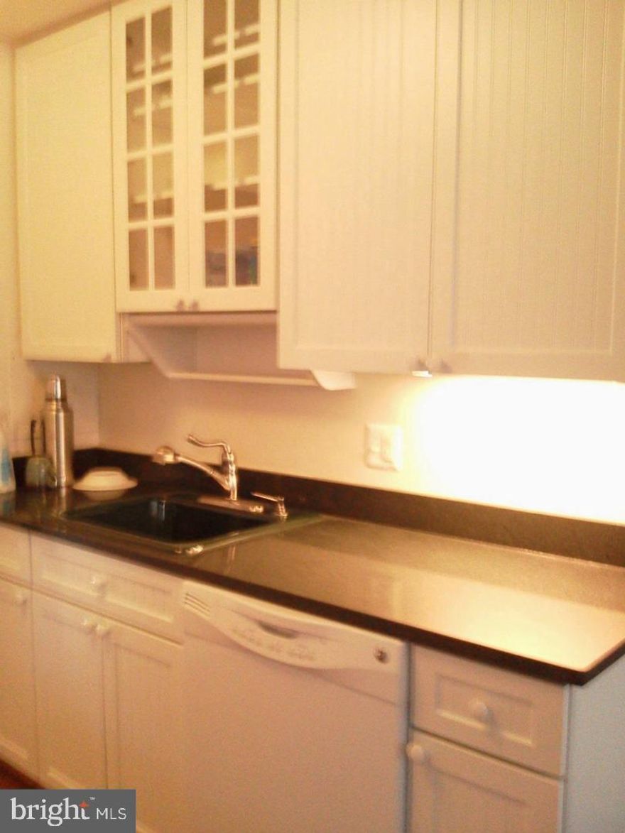 **Pet Friendly - FHA Approved!** This well-maintained unit has been priced to sell and awaits your personal touches while offering convenient, condo living, at an affordable price! Amongst the many features are its spacious sun-filled living room; separate dining area; oversized, eat-in kitchen with ample counter space and cabinetry; standard appliances and gas range; 2 generously sized bedrooms; 1 large, full bath; and a master suite with walk-in closet and en-suite half bath. This pet-friendly community comes complete with laundry facilities in every building (no additional payment required to operate...included with the condo fee) ; unassigned parking; 2 storage bin lockers that convey with the property, water, gas and sewer all covered in the monthly condo fee. **Electricity not included in the condo fee.**You'll love the outdoor community swimming pool during the hot Summer months. There's an ultra convenient RideOn bus stop ride located right outside the doorstep (within 367 feet) for access to the 45 bus with routes from Twinbrook Station to Rockville Station and Rockville Regional Transit Center. Countless community amenities are also available nearby including Montgomery College (0.9 miles away); Rockville Skate Park and Swim & Fitness Center (0.9 miles away); Woodley Gardens shopping center and across street from Woodley Gardens Park; and Rockville Town Square for an eclectic mix of shopping, dining and entertainment options. This home is priced to sell! Don't miss out on your chance to make this home today!