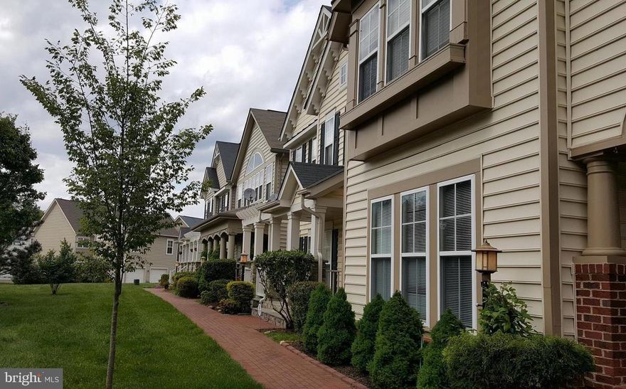 Welcome to this beautifully maintained Craftsman-style home in the sought-after Lorton Town Center community. This home offers a true investment opportunity to the right buyer. With 3 bedrooms, 3.5 baths, and a spacious, flexible floor plan, this home offers comfort, with modest updates, and the perfect location all in one package.  Once you step into the grand foyer and you’re greeted by gleaming hardwood floors, a formal living and dining room, and a conveniently tucked-away half bath. The gourmet eat-in kitchen features stainless steel appliances, granite countertops, with center island with recessed lighting, and a generous pantry. The kitchen opens seamlessly to a light-filled family room with a gas fireplace and walls of windows. Just off the kitchen, you’ll find a private courtyard, and a garage with soaring ceilings, with plenty of space for additional storage. Upstairs, the primary suite features, a large walk-in closet, and a spa-like bath with soaking tub, dual vanities, and separate shower. Two additional bedrooms share a full hall bath. The finished lower level provides even more versatility with recreation room, two bonus rooms, a full bath, and laundry/utility space—ideal for hobbies, a gym, media room, an office, or storage. An attached two-car garage and ample guest parking right out front ensure parking is never an issue at this home. Lorton Station offers unmatched amenities within walking distance—including two outdoor pools with shower facilities, a clubhouse for private events, scenic walking/jogging paths, tennis and basketball courts, tot lots, playgrounds, and walking trails that connect to nearby Joseph Plaskett Park. Ideal for commuters, residents also enjoy walking distance proximity to the Lorton Station VRE, the Amtrak Auto Train, Blue Line Metro, and Bus Stations, Route 1, and the Fairfax County Parkway. With a nearby slug line to L'Enfant and easy access to I-95. Fort Belvoir is under 3 miles away, and you’re just a short drive to Quantico, NGA, Burke Lake Park, Laurel Hill Golf Course, the historic Occoquan District, Liberty Market, and shops, and restaurants. Don’t miss your chance to own in one of Northern Virginia’s most vibrant communities!