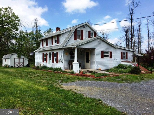 Handicap accessible 2/3 bedroom, 1 large bath home on a country acre. This house has had several updates in recent years including replacement windows, walk in shower and shower with jetted tub, mini split for AC. Nice knotty pine paneling in some rooms. Still finishing touches to be done in a couple areas downstairs and upstairs could use some work. Mostly secluded, level lot comes with a large outbuilding. Property backs up against East Waterford recreational park. This home and lot has a ton of potential and deserves a look. Call today!