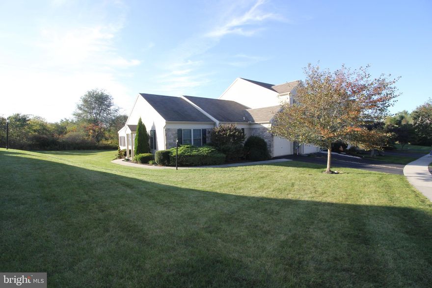 Live carefree in this beautiful end unit ranch style townhome. No lawn mowing or sidewalks to shovel. This 2 bedroom, 2 full bath home in the very desirable community of Deer Run features a new refrigerator, washer, stove, disposal, wood flooring in the living room and dining room and hallway, wall-to-wall carpeting in both bedrooms, ceramic tile in kitchen and in both bathrooms, full high-end window treatments in the sun room, blinds in living room, library shelf beside the gas fireplace; all in the last two years. The large master bedroom suit features a full bathroom with double bowl vanity. Additional home features include garage cupboards, a folding ladder shown in photos leading up to a fully floored attic perfect for storing holiday ornaments and more. The spacious living room with vaulted ceilings is bright and ideal for entertaining family and friends. The formal dining room with double wall light sconces is perfect for holiday dining. The four season sunroom with a ceiling/light fan combo is ideal for relaxing with beautiful views of the private backyard in any season. The newer washer and dryer stay. The natural gas heat and hot-water will provide you the kind of warmth and efficiency you expect. Convenient Derry Township location. Near major driving arteries and the Hershey Medical Center. If you re are not familiar with Deer Run it embraces the beautiful natural setting with trees, shrubbery, flowers, walking paths and sidewalks. The community is meticulously maintained which adds to its allure