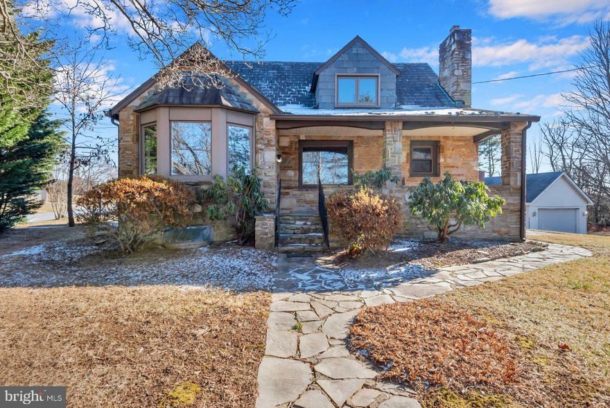 Welcome to 5701 Old Court Road — where space, comfort, and opportunity come together on a generous .34-acre corner lot in Windsor Mill. This classic detached home offers 3 bedrooms and 2.5 baths with a flexible layout designed for everyday living.

Step inside to find hardwood floors in the main living areas and an inviting eat-in kitchen with granite counters, ceramic tile, and a bright breakfast nook — perfect for morning coffee or casual meals. From the kitchen french doors open to a multi-level rear deck, creating an easy flow for relaxing or entertaining while enjoying the wooded setting and mature landscaping. Just outside the kitchen, there is a formal dining room space and sunny living room overlooking the home’s front yard.

A main-level bedroom and full bath add everyday convenience for guests or ease of living. Upstairs, you’ll find two additional bedrooms and a full bath. The improved basement includes a half bath, laundry room, and storage/ workroom area plus room to create a spacious home office, TV/ game room, or workout area. Outside features include two storage sheds, side parking pads for a total of 3–4 cars, and a BAT septic system installed in 2016.

Sold as-is, this home is ideal for buyers who want to personalize updates while building long-term value in a well-established location near major routes and shopping. Homes with this lot size don’t come along often in Windsor Mill — schedule your showing today and imagine the life you can build here.