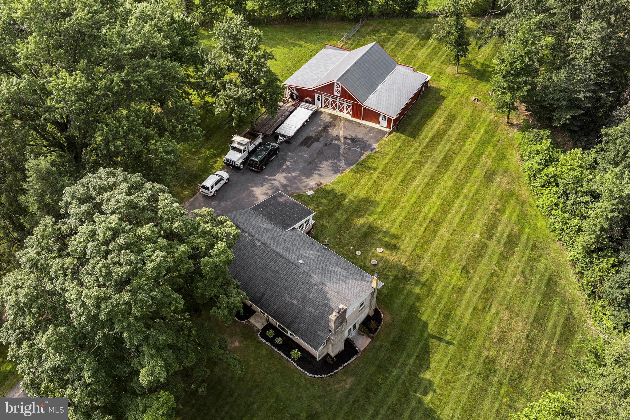 Beautifully updated, unique farmette on 10.33 acres just north of Lititz now available! This property has it all- a 1770 SF updated residence, a spacious barn-style garage, a fenced pasture, and even a customized motocross track. The 3 BR, 1.5 Bath home has received many upgrades within the past 5 years, including a remodeled kitchen and bathroom, an update to most of the flooring, replacement windows, and a new roof with 50 year asphalt shingles. Central air, heat pump with (leased) propane, electric heat, and a cozy wood stove will keep you comfortable all year long. Additional highlights include a dedicated dining room, a sunny screened-in porch, and a spacious unfinished basement. A 40x60 barn-style garage with water, electric, and generator hook-up is this property's standout feature. With two separate garage bays, a dedicated shop, and a barn area that previously housed horses, this versatile building has it all. Adventure awaits right in your backyard with an acre of open motocross track featuring ramps, plus approximately 3 acres currently in tillage (potential exists for more tillable ground by regrading the 4-wheeling field). Clean & Green tax savings offer added value, while the property's modern updates blend seamlessly with rural charm- perfect for hobby farming, outdoor recreation, or simply enjoying the country lifestyle.
