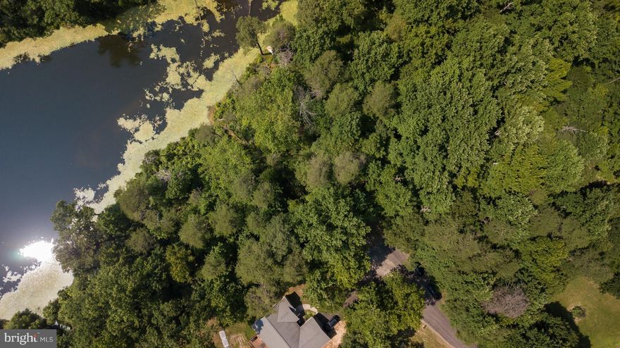 Waterfront lot on Lake Madison in Presidential Lakes with almost 250 ft. of water frontage.  Property at end of cul-de-sac and across street from community's clubhouse, picnic areas, outdoor pool, tot lot, tennis courts, private roads and protective covenants.  Build your dream home - peaceful & quiet. Easy commute to I95, Northern VA, Quantico, NSWC Dahlgren, AP Hill, and Southern Maryland.