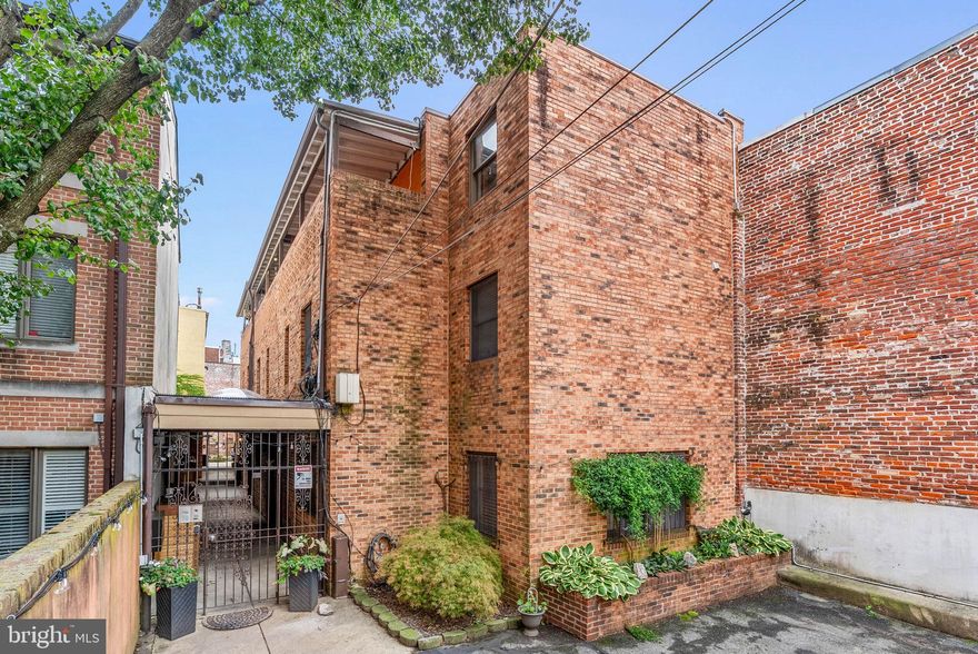 Welcome to 238 Queen Street #1, a 2-bedroom, 2-bath residence tucked inside a quiet, gated community in the heart of Queen Village. Enjoy access to a shared courtyard perfect for outdoor entertaining, along with private, off street parking and secure entry. Inside, the open concept main level features an updated kitchen with island seating, stainless steel appliances, granite counters, and a convenient beverage bar. The kitchen flows seamlessly into the living and dining area, anchored by a gas fireplace that adds charm to the space. Upstairs, you’ll find two well-sized bedrooms, including a spacious third-floor primary suite with an ensuite bath featuring heated floors, generous closets, and a private patio. The second bedroom offers great versatility for guests, an office, or workout space, with a full hall bath and convenient laundry nearby. This six-unit community is known for its friendly neighbors and beautifully maintained courtyard, making it a true hidden gem in Queen Village. Enjoy all the best of city living, walkable to Mario Lanza Park, New Wave Café, For Pete’s Sake, Headhouse Farmers Market, and so much more. Don’t miss this incredible opportunity to enjoy convenience, comfort, and charm in one of Philadelphia’s most sought-after neighborhoods.