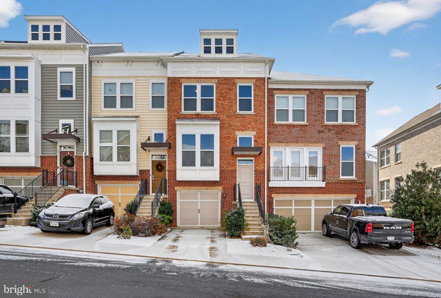 Welcome to 42671 Redeemer Terrace, a beautifully maintained townhome in the highly sought-after Brambleton Landbay community, offering over 2,250 square feet of light-filled living space with 4 bedrooms and 3.5 baths. This home features box bay windows on two levels, a rare three-level rear extension, a gourmet kitchen with granite countertops, stainless steel appliances, center island, and a sunroom that opens to a private Trex deck. Upstairs, the primary suite features two walk-in closets and a luxurious en-suite bathroom. Two additional bedrooms offer ample space and share a full hallway bathroom.The fully finished walk-out lower level leads to a beautifully landscaped, fully fenced backyard, ideal for relaxing or entertaining. Conveniently located minutes from Brambleton Town Center, major commuter routes, and approximately 3 miles from the Ashburn Metro, this home offers low-maintenance living in one of Loudoun County's most desirable communities.

Rent includes HOA fee, Verizon FIOS basic Internet & TV, lawn care, and access to Brambleton's premier amenities, including six pools, tennis and pickleball courts, trails, tot lots, and a community center.