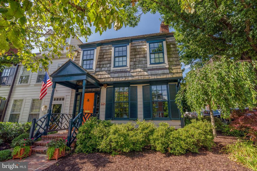 This gorgeous, fully remodeled, end-unit rowhouse in the heart of Old Town offers a desirable floor plan that is perfect for easy living. The main level features a sizable formal living room with a wood-burning fireplace, wood floors and 4 windows providing amazing natural light. The back of the home is inviting with an open concept kitchen, dining room and family room. A spectacular gourmet kitchen features plenty of cabinet storage, a peninsula with counter seating and a separate wet bar/beverage center. The welcoming family room offers an additional wood-burning fireplace. The large, fully brick walled  back garden and patio have gated access to 2-3 off-street parking spaces. The second level provides 3 bedrooms and 2 full baths, including an en-suite primary bath, plus a bonus space with built-in bookcases perfect for a library, office or sitting room. The top-level office or potential fourth bedroom boasts a skylight, additional full bath, laundry, storage closets and access to the roof deck. With nearly 2300 square feet this Old Town gem is in a prime location just 1 mile to King Street Metro, steps to the bus stop and easy access to National Airport, Washington DC, Amazon HQ2 and major commuter routes. Leave your car at home and walk to the Potomac River waterfront, shops, restaurants, parks and all that Old Town has to offer.
