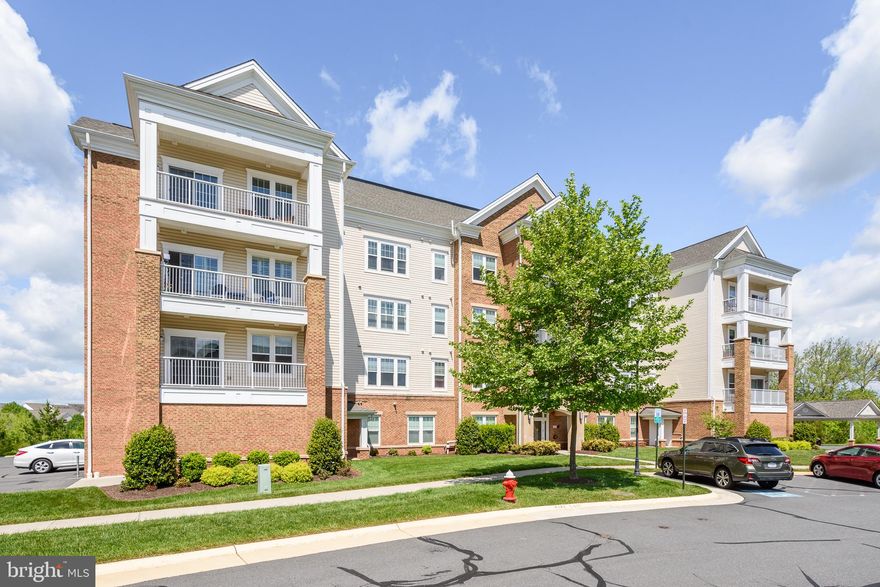 Immaculate Beaumont model with spectacular western views in desirable Potomac Green. This 2 bedroom, 2 bath condo features an open concept living area with a large family room, dining room, and kitchen. The kitchen has granite counter-tops, stainless steel appliances (upgraded 28cu refridgerator and garbage disposal), and added cabinetry topped with butcher block features abundant storage. Enjoy two spacious bedrooms with great natural light plus full baths with tile floors and granite counter-tops.  Don't worry about weeding through your clothes for your move as this Master Closet is outfitted with a custom organizer! Second bedroom features custom built in desk and bookcase-super functional. Enjoy the STUNNING sunsets from the private western facing balcony- perfect way to end everyday.  So many upgrades to list--new air conditioning unit, upgraded lighting, garage storage... Convenient to One Loudoun, major transportation routes and all of the community amenities.