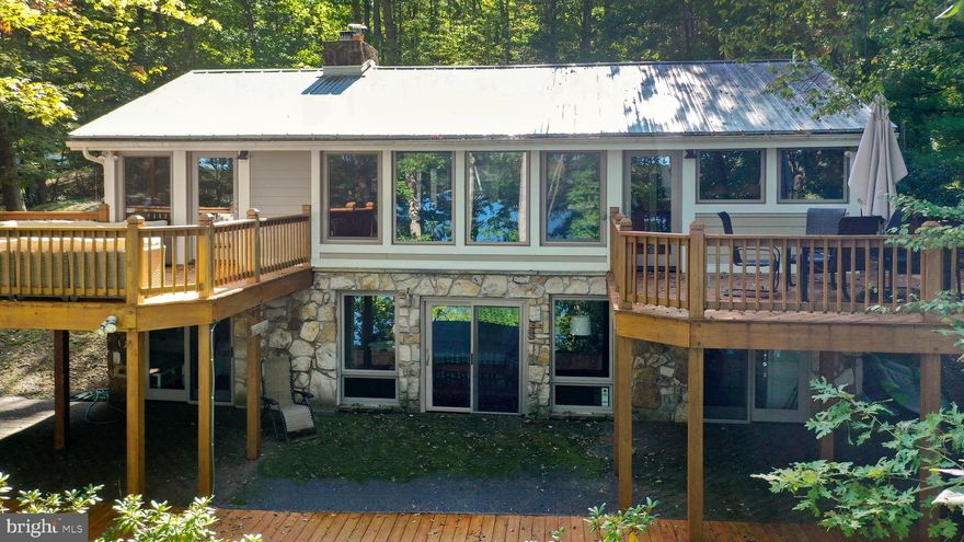 Truly wonderful lakefront property in the sought after Turkey Neck area of Deep Creek Lake with two large decks for maximum views of Deep Creek Lake! 119 feet of waterfront, private Type A Dock, updated interior with two living spaces for family and friends. Phenomenal lake views yet the property offers privacy - perfect situation. You will love all of the windows which make the home light and bright. Take a look for yourself!