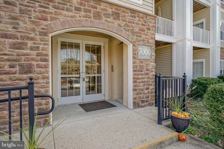 Come tour this beautiful former model condo with upgrades like wainscoting, crown molding and tray ceiling in front entrance hall.  This home has all the amenities of one floor living at its finest.  There is an open kitchen with plenty of cabinets and counterspace. The top of the line granite counters and wrap around cabinet spacing makes it super convenient to cook and entertain.  There is a breakfast bar open to the kitchen/dining areas.  A large pantry adds to the convenience and offers additional storage space.  The kitchen is open to the living and dining areas.  Off the living room is a patio overseeing the front of the building.  This offers added convenience to the homeowner to enter the condo direct from the parking areas without having to go through the building.  The master bedroom has a large walk in closet and full bath.  The 2nd bedroom has modern wainscoting and a full bath. This can used as a spare bedroom and/or office space. There is a laundry/utility room with storage space to complete this condo.  Extra storage space is located in the basement of the building for holiday decorations or other storage needs.  The community has a clubhouse with an active full schedule to entertain the owners. There is a pool available, fitness center, game room, tennis courts, bocce court, putting green, and many other activities that the residents can participate in.  Don't let this condo pass you by.  Join the convenience of this 55 and older community and start developing new friendships and building your new memories in this  beautiful condo.  Tour it today. You will want to move in tomorrow.