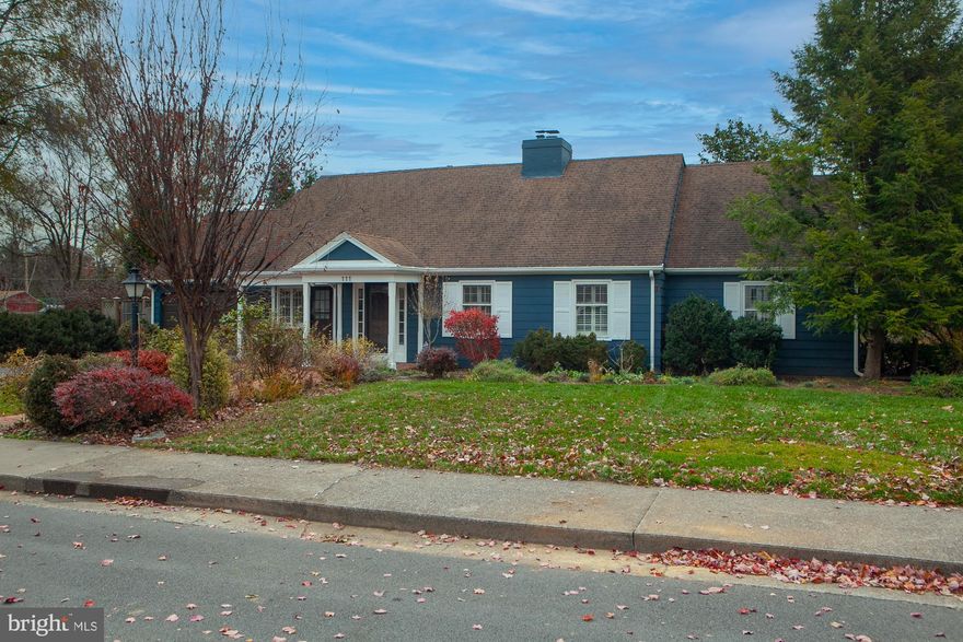 Substantial Price Drop  Motivated Seller  (Your Lucky Day) MUCH MUCH More than your average ranch house! (Contemporary) . Yes, a home with a  lake view  in-town.  1 acre property overlooks Lake Thomas.  Charming, elegant, spacious home on a quiet, non-through street, just minutes away from Memorial Park, Downtown Martinsburg and fine dining.  Combines possible one-floor living along with gracious capacity for a family. Second floor bedrooms, library, office. 
A delightful combination of city and country in this expanded mid-century home, 111 North Rosemont was built in 1968. Over time, the house was substantially expanded most notably with the addition of two large wings each with Palladian windows and soaring wood ceilings.  
All utility bills are available.  
The covered front porch welcomes you to the generously sized living room with south and west facing windows and an  elegant staircase to the second floor.  A gas fireplace with built-in bookshelves on one side, will warm your winter evenings.
The dining room has French doors looking to the fenced in patio.  Its east facing windows start your day with the morning sun. 
The bright, sunny kitchen with breakfast nook was totally remodeled in 2015 with solid wood cabinetry , high level granite counters, and an oversized island; renovated with attention to quality and detail. The warmth of the solid wood cabinets in a heather tone combines with the tones of the sweeping Pregrine granite counter tops. Focal points include the island and bank of cabinets offering a handy in-kitchen pantry.  Stainless steel appliances new in 2015, and a designer copper sink adds a French country touch.
From the kitchen, you are welcomed to an expansive den with a dramatic rose brick gas fireplace that extends upward to the vaulted ceiling. It is flanked by built- bookshelves on both sides.  A new ( 2023 ) bay window faces north, Palladian windows face East, and a set of French doors on the south opens to the enclosed patio and garden beds. 
The light-filled ground floor laundry room includes functional counter space and wood cabinets.
Other features: All second floor rooms are full height; a triple zone heating/cooling system updated in 2016 and 2019; ample closets;  and plantation shutters are installed throughout the house, with shades for the Palladian   windows.
The generously sized carriage shed boasts an automatic garage door, half  bathroom
 and large built-in work bench. The second floor, accessible via pull-down stairs, offers additional storage space.  Solar panels installed in 2020 contribute to energy savings every year. 
A longtime previous owner was an avid gardener. She laid out the rock garden design with its charming brick pathway and overall harmony  with the natural limestone outcroppings that add so much character to the backyard.  The park like  landscaped yard includes established perennials  beds surrounding the house with a pollinator pocket garden in the patio.  Peonies herald the spring as do numerous blooming shrubs throughout the summer.  But there's plenty of room for you to add you own touches.  Further along toward the lake are a  graceful willow tree and a charming cherry tree, both offering changing color throughout the year to the view from the kitchen window.  A majestic black walnut tree stands sentinel as you enter the lower yard and approach the west bank of Lake Thomas, a serene quarry lake in the middle of Martinsburg.
Convenient location.  Just blocks to down town Martinsburg, fine restaurants, Marc Commuter train to DC, EZ access to I-81.  Wonderful walkable neighborhood.