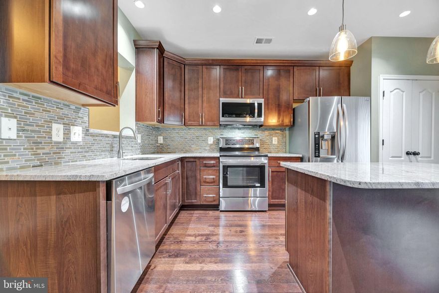 Come see this stunning end unit townhouse in a gate community. Laminate flooring on main level!  Open concept kitchen with granite counters. True master bedroom with walk-in closet with a double sink master bathroom with a sunk in tub and private shower. Washer and dryer on upstairs living level. There is a New HVAC system and New water heater. Location location location! There is metro access 2 minutes away and restaurants in walking distance.