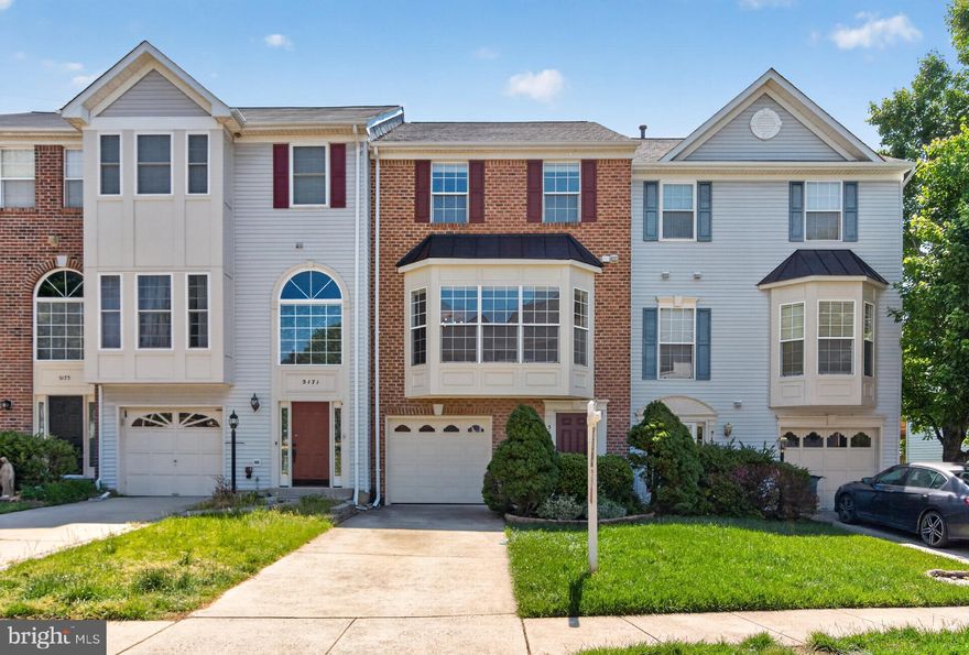 Welcome to 5169 Ballycastle Circle, a terrific Emerson model backing to trees in the north end of sought-after Kingstowne! This brick-front townhome has a garage and the lovely evergreens and boxwoods leading up to the front door give it great curb appeal. As you enter the foyer greets you with tile floors and there is new carpet on the upper and lower levels. Sunlight flows in from the huge bay window in the living room. There are dazzling hardwood floors in the living and dining rooms which also show off classy crown molding. Bright and appealing, the kitchen features modern 42-inch white cabinetry, sleek granite counters and backsplash, stainless appliances, lots of recessed lighting and an island with a double-sink and an overhang for barstool seating. Just off the kitchen, the family room offers a relaxing classic fireplace with a detailed wood mantel. Step out from the charming breakfast nook to the upper deck with its sweeping view of trees. Upstairs, all three bedrooms have ceiling fans and the impressive owner’s suite also has a soaring vaulted ceiling, two walk-in closets with built-in shelving and a double-window overlooking greenery. The owner’s bath has a deep-soaking tub along with a separate shower and dual-sink vanity. For added convenience, the laundry is on the upper level. Downstairs is a spacious rec room with a custom corner built-in and a sliding glass door leading to the lower deck and fully fenced-in backyard. There is also a versatile additional space just off the rec-room that can be used as an office, playroom or even home gym! This fantastic home comes with the endless list of Kingstowne amenities - pools, gyms, community centers, tennis, pickleball and basketball courts, tot lots, 12 miles of walking trails and more! It’s also close to two Metro stops, two town centers and all commuter routes!