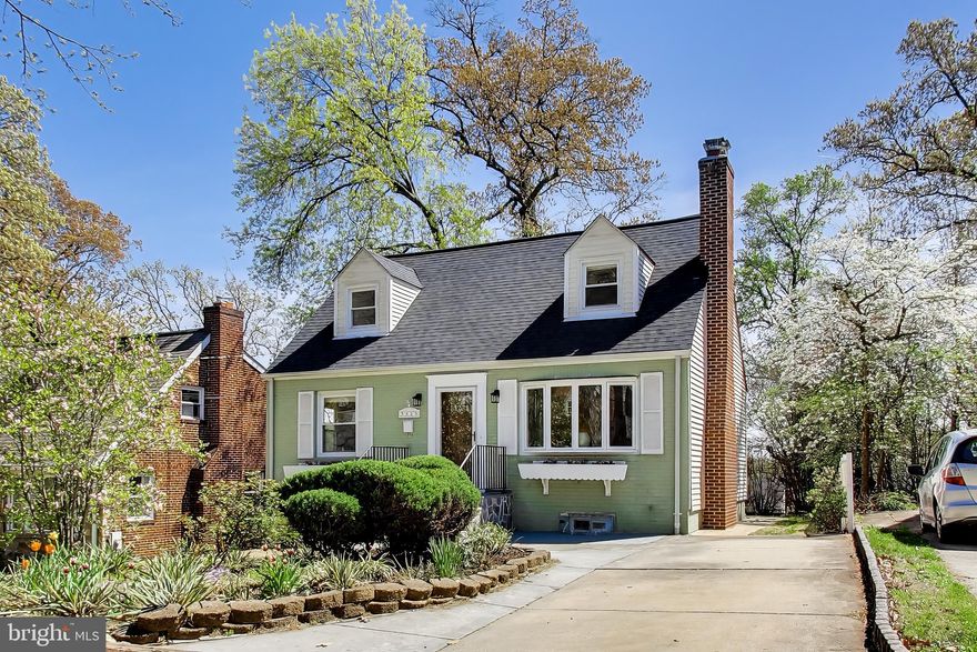 Perfectly perched, this expanded Cape Cod offers a larger footprint and delightful treetop backyard views. Its main & lower-level bump-out, along with the upper-level shed dormer, provides added living space across all three levels. The heavy lifting is done—new refrigerator (2025), HVAC, Trex decking (2023), water heater & water filtration system (2021), roof and rebuilt chimney w/ new liner (2019). **See disclosures for ALL UPDATES.** Main level highlights include a front living room w/ bay windows & wood-burning fireplace, a formal dining area, guest bedroom, full bathroom and an open-design kitchen w/ a new stylish tile backsplash. Anchoring the rear portion of this level is an impressive second living room featuring hardwood plank ceilings w/ recessed lighting. This bonus living area opens onto a large Trex deck w/ pergola—a perfect sanctuary for day-to-day comfort and relaxation. Upstairs are two well-proportioned bedrooms and a contemporary bathroom boasting Argent porcelain tile and Duravit fixtures. The lower level (w/ private entrance) offers maximum versatility w/ its second kitchen, full bath, and bonus room—ideal for an in-law suite, au pair setup, or income-generating room rental. The basement is complete with an expansive laundry room and bonus space for all your storage needs (waterproofed & insulated in 2023). The multi-tiered backyard is fully fenced and blooms with a variety of flora throughout the year. Additional hardscaping, including a circular stone paver patio, awaits in the lower rear yard, creating the perfect setting for evening fire pit gatherings. Cheverly blends a small-town feel with exceptional accessibility. Just a short walk to the Cheverly Swim & Racquet Club and Euclid Street Neighborhood Park, residents enjoy access to walking trails, playgrounds, exercise areas, and green space for everyday recreation. The neighborhood is known for its vibrant sense of community, w/ annual traditions such as Cheverly Day, seasonal farmers markets, holiday celebrations, and local events that bring neighbors together year-round. Approx. 14-minute walk to the Cheverly Metro. Quick access to Rte. 50 makes commuting into Capitol Hill & downtown DC seamless. Conveniently located near Dakota Crossing (Costco, Lowe’s), Woodmore Town Center (Wegmans), Riverdale Park (Whole Foods) and Univ. of MD. 5823 Dewey Street is a wonderful home in a great neighborhood—come make it yours!!