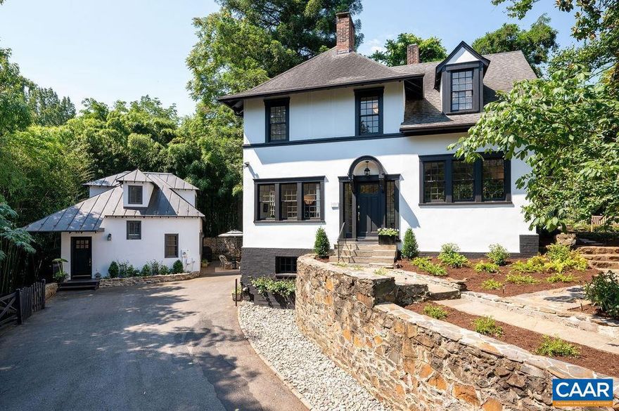 One of Charlottesville's premier properties, tucked away on a private .28 acres, a few blocks to UVA main grounds, hospital & Scott Stadium. This historic property includes a flawlessly renovated c. 1914 Tudor Revival home, designed by noted architect Eugene Bradbury AND a fabulous 1,100 square foot, 2 bedroom, 1.5 bath guest cottage. Exquisite details include: expertly re-plastered & painted interior walls, arched openings, painted hardwood floors, restored exterior (stucco, trim, paint), 4 fireplaces, true divided light windows, elegant dining & living spaces including an all-glass "conservatory" overlooking the gardens. Impressive landscaping features numerous stone walls, terraces, mature plantings & trees (don't miss the towering redwood!) designed by Orland E. White, who bought the home in 1928 & also designed the VA State Arboretum. The chic, c. 1930 guest cottage features a full kitchen, open living /dining spaces & delightful stone-walled courtyard. Spoil your guests or generate substantial income through long or short term rentals. Unique opportunity to own a remarkable property right in the middle of all things UVA!,Glass Front Cabinets,Granite Counter,Painted Cabinets,White Cabinets,Fireplace in Bedroom,Fireplace in Dining Room,Fireplace in Living Room