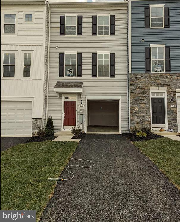 Gorgeous Brand new Never been lived in, 4 Bedroom 3.5 Baths 1 car garage 3-level townhome located in the Martinsburg Station community Martinsburg, WV offers a large floor plan with a ton of natural light. This home is perfectly situated for luxury and peaceful living. Take this unique opportunity to live in one of the best neighborhoods in Martinsburg! Convenient to stores and schools and interstate. Community Pool, Clubhouse, catch and release lake for fishing, tennis courts, and playground, all within easy walking distance.
This unit also has a large driveway and garage for off-street parking, Upon entry into this wonderful townhome, you are greeted with a welcoming entry with a handy coat closet. The lower level offers a finished rec room (could be a fourth bedroom space) with a full bathroom and access to the backyard. The main level offers luxury vinyl plank flooring throughout and a spacious living room with an adjacent powder room. The well-appointed, eat-in kitchen offers an 8-foot island, Deserts Silver Quartz countertops, stainless steel appliances, and an adjoining dining area. The spacious primary suite features a generous walk-in closet and an en suite bath with dual sink vanity. Two secondary bedrooms & full bath, a linen closet, and a centrally located laundry closet with an in-unit washer and dryer complete the upper level!
Martinsburg Station is located just minutes from I-81, midway between Winchester, VA, and Falling Waters, WV. Martinsburg Station offers the best of both worlds with easy access to commuter routes to Maryland, Virginia, or Washington along with small-town friendliness and wonderful mountain views.