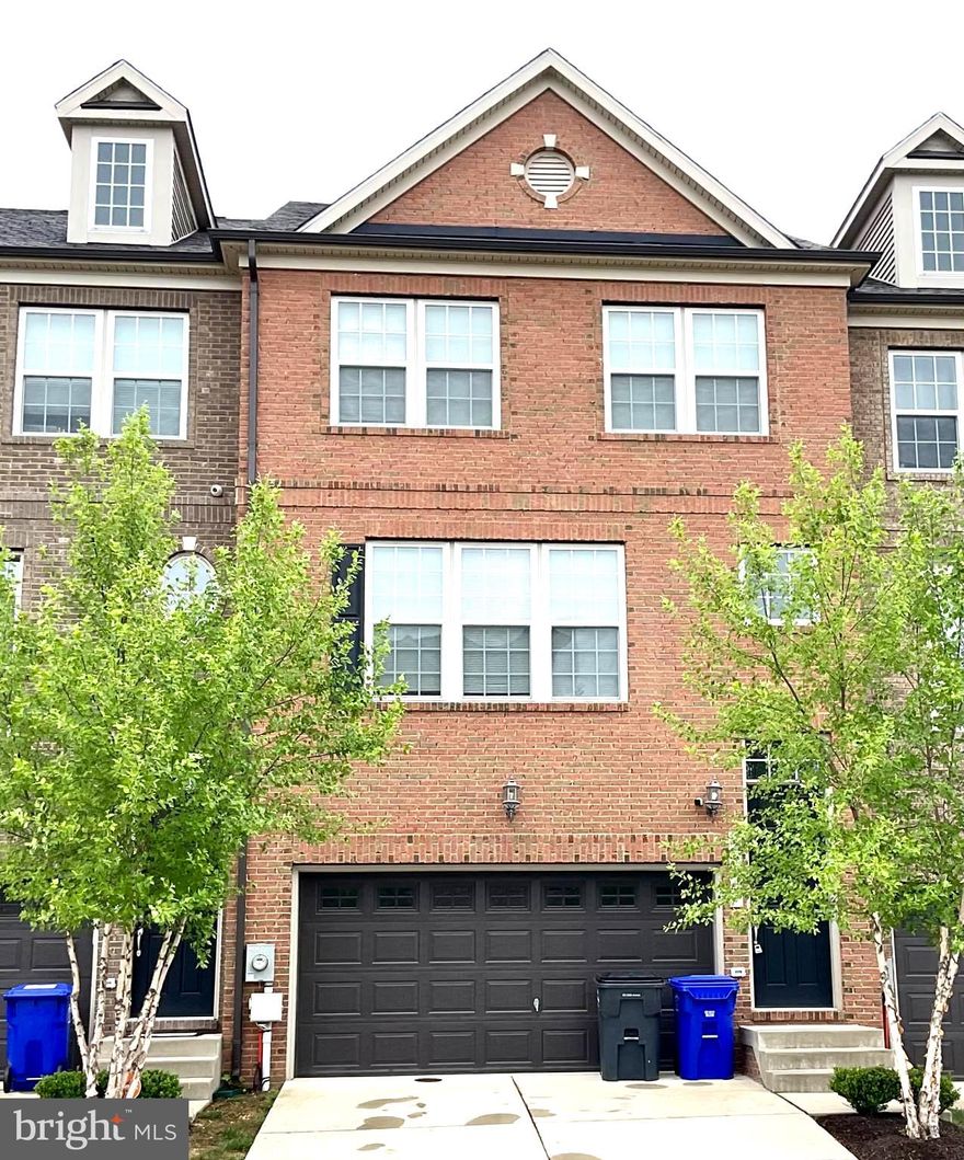 ALMOST NEW is the way to go!  And lawncare is included!  This 3 Level Townhome in the sought after Hamilton Park Subdivision is 4 years young!  The main level of this 3 story, brick townhouse features a spacious family room with tons of natural light with an open floor plan into your gorgeous kitchen with endless cabinets and porcelain ceramic marble countertops, modern tile backsplash, stainless steel appliances that are only one year old include the gas range, built in microwave, and refrigerator. The dual wall ovens are only 4 years old.  Large separate dining area offers plenty of room for an oversized table surrounded by natural light.  Main level also has a 1/2 bath and there's a sliding glass door exit from the kitchen onto your spacious low maintenance deck. The upper level includes 3 bedrooms, a full bath in the hall, as well as a the conveniently located, large stackable washer/dryer in the hallway. The primary bedroom features a large private bathroom with glass shower doors, beautiful lighting and large WIC. Your new home also features a fully finished basement perfect for a home office or family room, another 1/2 bath and access to your attached 2 car garage. Your new home is conveniently located near endless dining, shopping & entertainment in addition to National Harbor, DC, VA! Close to Andrews AFB, Bolling AFB, Indian Head Naval Base and PAX River.