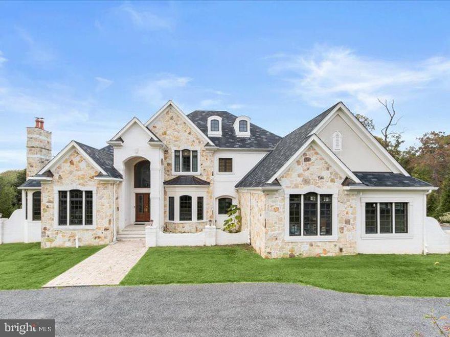 This true custom estate in the heart of Potomac Village showcases exceptional design, master
craftsmanship, and superior engineering ̶ offering over 11,900 sq. ft. of refined living space on a
private, beautifully landscaped acre. • Spacious open-concept living spaces with soaring ceilings,
premium hardwood floors, detailed trim, and custom millwork.
• Chef’s gourmet kitchen with dual Q-Taz granite islands, Sub-Zero and Wolf appliances, Bosch
dishwasher, and large walk-in pantry.
• First-floor master suite with ultra-luxury bathroom featuring custom tile shower, separate Toto sinks,
Toto toilets, and dual walk-in closets.
• Grand two-story family room with fireplace and panoramic garden views.
• Walk-out lower level with full in-law suite, private gym, teenager’s den, and meditation room.
• Includes Electrolux front-load washer and dryer, farm sink, two full baths, and a covered patio with
fireplace, wired for TV and built-in speakers.
• Outdoor living: concrete deck with gazebo featuring fireplace, ceiling fan, and media wiring.
• Oversized finished 4-car side-load garage with and finished attic space upstairs above two
bedrooms.
• 48-kW whole-house generator, public water and sewer, AO Smith gas water heater, triple
water-source geothermal HVAC system.
• Marvin windows throughout, 138 recessed lights, and extensive low-voltage wiring for speakers and
media systems.
• Circular driveway and professionally landscaped grounds with golf-course and park-like views.
Information Deemed Reliable But Not Guaranteed