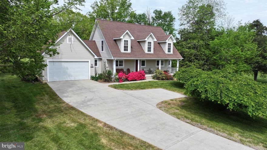 Lake Living at Its Best! Nestled in the highly sought-after Morgan I neighborhood on the public side of Lake Anna, this beautifully maintained, one-owner home offers the perfect combination of comfort, potential, and location. With over 1,900 finished sq ft above grade, plus an unfinished walk-out basement and an assigned boat slip, this property is a rare opportunity to enjoy everything Lake Anna has to offer—whether as a full-time residence or a weekend escape.

Step inside and you’ll find a warm and inviting layout designed for both everyday living and entertaining. The main level features a spacious primary bedroom suite, ideal for those seeking the convenience of first-floor living. Soaring vaulted ceilings enhance the bright and airy living space, and the living and dining areas flow seamlessly into the kitchen, creating a cozy and functional space to relax or gather with family and friends.

Upstairs, additional bedrooms and living space offer flexibility for guests, home offices, or playrooms. The unfinished walk-out basement lets your imagination run free—customize it with a rec room, home gym, workshop, or anything else your lifestyle calls for.

Enjoy peaceful mornings and stunning sunsets from your deck or patio, and spend your days on the water with your very own assigned boat slip, just a short walk away. The spacious 2-car garage offers plenty of room for lake toys, tools, vehicles, and more.

Located just minutes from local marinas, restaurants, breweries, and shops, and part of one of the lake’s most desirable communities, this home offers not only a beautiful place to live, but a lifestyle filled with fun, relaxation, and adventure. Come see why so many people are falling in love with Lake Anna living—your next chapter starts here.