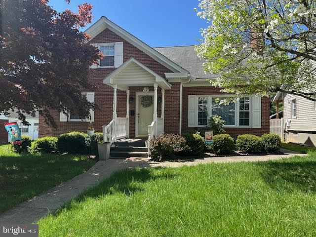 Very Cozy and spacious brick home with many updates. Gas fireplace, hardwood floors, 2 bedrooms on the first floor and full bath, new flooring in kitchen, sunroom with replacement windows, vinyl privacy fence in back yard, off street parking plus 2 car garage, storage shelves in basement, on demand hot water heater, convenient location to schools and Rt. 322. Natural gas heat. Call for your tour today!