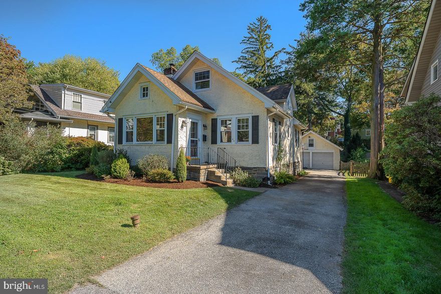 Lower Merion Single Family Colonial Home with Curb Appeal, long driveway, large level fenced in yard and 2 Car Garage in Wynnewood Valley (Havertown Post Office and Lower Merion Schools).  Pull up the driveway to this charming original Sears Roebuck home freshly painted where the 1st floor Living Room is expansive and complimented with hardwood floors  and a wood burning Fireplace.  The open floor plan continues straight to the Dining Room and updated Kitchen with Century Kitchens wood cabinets, Granite counters, stainless steel appliances, Gas range/oven, Bosch dishwasher, Farmer's sink and  window overlooking the rear yard .  The double sided glass Cabinets between the Kitchen and Dining Room allows easy storage access and sunlight to pour through the home.  A mudroom off the kitchen with custom hand made cabinet for coats, shoes, book bags, scarves and dog leash are by the French Doors to the rear deck and large level fenced in yard plus expansive driveway.  2 Bedrooms are located on the main level along with a full Bath and new vanity.  2nd level leads to newly refinished hardwood floors and a large area perfect for a desk/home office and leads to the gracious Main Bedroom for a king size bed and so much more!  A half bath and storage area with potential room to expand bathroom or expand closet completes the 2nd level.   The Full Lower level has high ceilings, a partially Finished area, Walk out to Rear Yard, divided Laundry and Workshop area with room to finish and expand living square footage  to meet your needs.  The Rear Yard has several raised beds for your green thumb to grow vegetables and herbs while enjoying a level fenced in sunny yard throughout along with the 2 Car Garage allowing extra space for gardening equipment.  Expansive driveway has plenty of parking for more than 4 cars.  2023 New Central Air Conditioning, 2023 New Electrical Box.  851 Beechwood Road has a Havertown address and Post Office but is located within Lower Merion Township. Penn Wynne Elementary, Black Rock Middle School and Harriton High School in Lower Merion Township are the selected schools for this home. Walk to Brookline/Beechwood Norristown Speed line and several Parks.  Minutes from Whole Foods and Suburban Square.  Close drive to CC Philly, major routes.