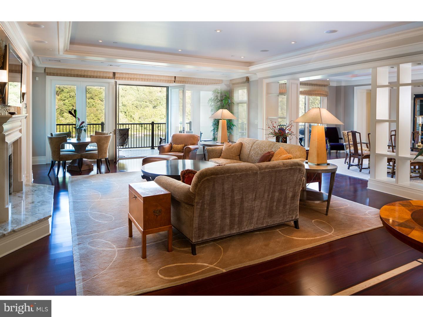 Offering spectacular #luxury #waterfront living just a minute south of #NewHope Borough, this river-facing, floor-through condominium is designed to embrace its stunning views. Enjoy walls of windows and French doors accessing a sizable riverfront terrace from every main room. Located in Waterview Place, a boutique-sized, exclusive condominium community, this residence is accessible via a secure elevator that opens into its foyer. Inside, almost 4000 square feet of custom-finished, light-filled interiors await. Throughout, substantial millwork, pristine wood floors, custom recessed lighting and neutral paint colors create a canvas that will accommodate nearly any style. The formal living room with gas fireplace is scaled to accommodate several seating areas and is open to the formal dining room with custom shelving serving as a subtle divider between the two spaces. The custom chef's kitchen with casual dining area and island features Viking, cherry-paneled Sub-Zero and other top appliances and fixtures, including a full-size wine refrigerator. All is set within furniture-finish, natural cherry cabinetry and granite countertops. A den/office with fireplace and custom desk and built-ins is situated to the left of the living room. All of these rooms access the terrace, fabulous for entertaining and everyday use. Private quarters include two guest bedrooms that share a bath and a sumptuous main bedroom suite that also access the terrace. This bedroom's huge walk-in closet is finished with extensive, cleverly designed built-ins and a laundry area. With timeless marble and stone finishes, the main suite bath provides a spa-like experience with jetted soaking tub, oversized shower with seamless glass enclosure, double vanities and separate water closet with bidet. Additional conveniences include secure garage parking with elevator access to your home and a generous amount of overflow parking for guests. Leave behind the responsibilities of a single-family property without sacrificing quality of life when you choose Waterview Place, New Hope's only luxury condominium community.