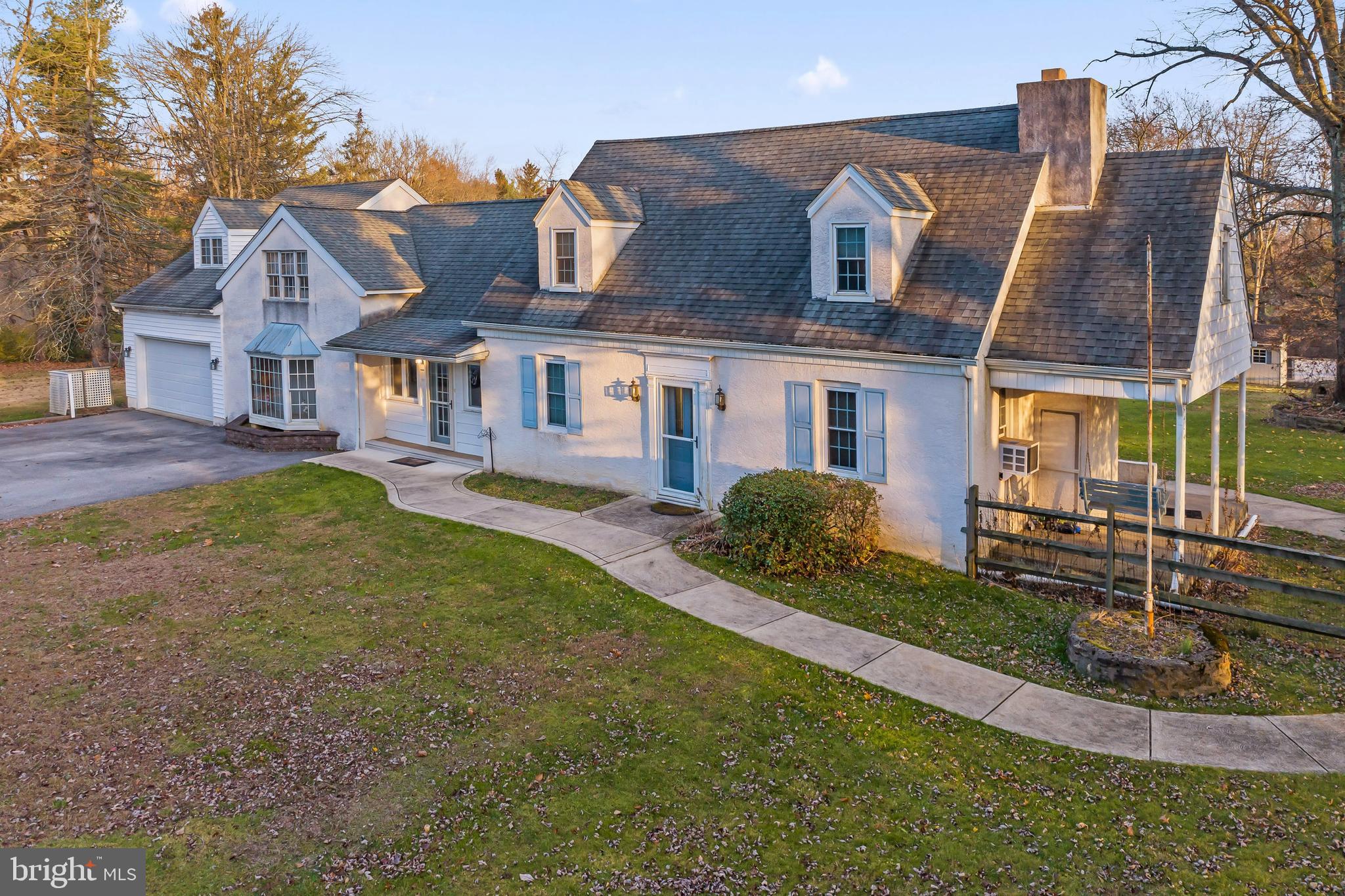 Welcome to 36 Skyline Drive, Glen Mills PA. On 2 acres along a quiet street in Glen Mills sits this expanded Cape Cod-style home featuring a home currently set up as two distinct living quarters joined by the common enclosed center porch allowing you to freely move between the two "wings" of the house. Although it appears to be two separate units this is zoned a single-family home. The original portion of the home on the right consists of three full bedrooms and two full baths. On the first floor, you have the living room with access to a covered side porch, the dining room, a full kitchen, a full bathroom, and a bedroom just off the front foyer. The second floor of the main house has two huge bedrooms. Bedroom 1 has amazing space, with two large closets, built-in drawers, and a massive bonus room used as a sitting room/ office with a full closet, custom shoe closet, and plenty of flexibility for your design choice. Bedroom 2 is another big bedroom, with plenty of closet space and its own walk-in closet to be configured how you like. Just around the corner is the second-floor full bathroom. There is also a full basement, with a walkout to stairs to the backyard, ready to be refinished, and features an old fireplace, not currently in use. Making your way to the first-floor enclosed connecting porch you will enter the in-law quarters. This unit has amazing space. The living room allows plenty of flexibility for placing a lot of furniture in this area. A full bathroom is situated between the living room and the kitchen. Tucked on the right as you enter the kitchen is the laundry area. The kitchen is open and has two pantries and ample cabinet storage. Just off the kitchen is a sunroom looking out to the side and rear yard with sliders to the in-ground pool area. You can also access the two-car garage from this area. On the second floor of the in-law suite is a loft sitting area, which can easily be turned into a 5th bedroom. There is a large full bathroom on this level, as well as a very large bedroom with vaulted ceilings, two large closets, additional storage closets, and a sitting area nook. The in-law wing has Central Air and the main house uses window AC. The backyard is made for entertaining. An oversized patio connects both wings and is connected to the fenced-in inground pool area. In addition to the patio and pool area, there is still plenty of backyard to enjoy with another lower patio with two sheds for storage. This is a unique opportunity for someone who needs in-law quarters, extra living space, or wants to reconfigure the house to their dream home on an amazing lot! Offers due MONDAY, DECEMBER 4 by 1 PM.