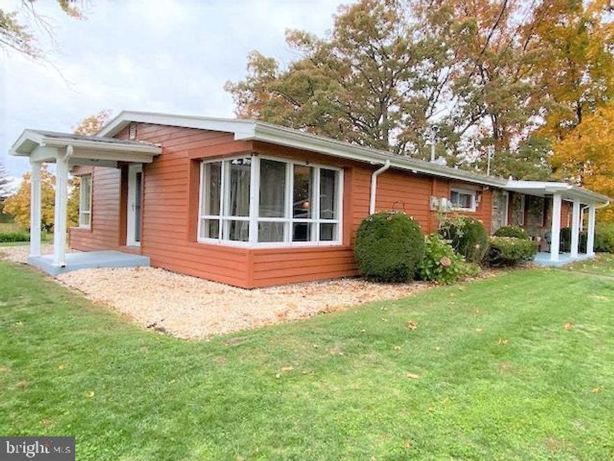 You are not going to believe this!! Frontage on a wild trout stream AND overlooking hole #14 of Lost Creek Golf Course! This could definitely be your happy place. Well maintained 3 bedroom home offers a large maple kitchen with custom features including a huge pantry, maple floors in the very spacious living room, bright and cheery sun room is heated, office/laundry room if you work from home, brand new 2022 Heat Pump and electric service, 2 bay detached garage, 8x14 garden shed, paved driveway, and solar panels that make living here VERY cost effective. Owners have a LOMA letter so NO flood insurance costs!! Schedule to take a peek.