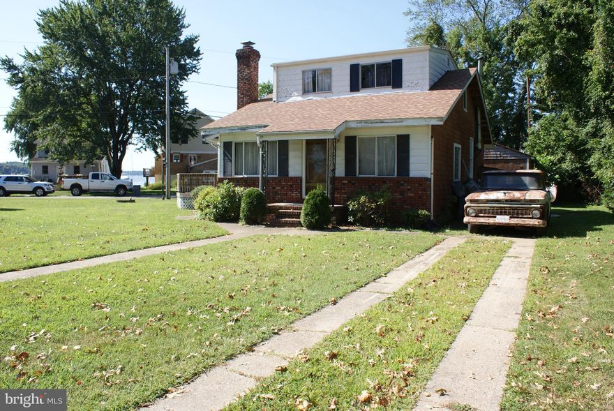 This home has been well-loved by the same owners for fifty years! It's located on a corner lot with beautiful views of the Sillery Bay on the Magothy River, and sits adjacent to luxury waterfront homes. This 4 bedroom, 1 bath home is very spacious featuring a large living room with a wood-burning fireplace, a separate dining room off of the kitchen, and a first-floor bedroom. The gorgeous views of the Magothy River can be seen from many areas of the home. Being this close to the river, you will enjoy the year-round breeze. This home has great bones, bring your creativity and make this home new again. Long Point has several community common areas near the water. For a small annual fee,  you can join the community association and apply for a boat ramp key. The community also features an updated Club House.  The roof has been recently replaced.  This is an Estate Sale, the seller will not negotiate or entertain repair requests.