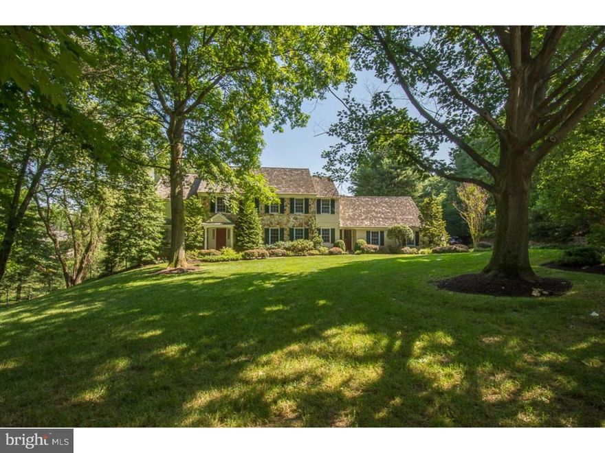 Located towards the end of the cul de sac in a superior Gladwyne neighborhood, walking distance to the center of town,community tennis crts as well as Gladwyne Elementary, find this most charming 5-6 Bedroom 4  Bath Stone Colonial set well off the quiet road w/fenced pool and yard. A light filled two story Foyer w/inlayed hardwood flrs showcases the stepdown L/R w/wood burning f/p& marble surround on the left & is balanced by the formal D/Rm w/crown molding and substantial detailed chair railing to the right. Both handsome and functional is the richly paneled Library. Offering 2 custom built-in desks,  shelving & file storage this room opens to the rear deck making it ideal for work as well as outdoor enjoyment. Kitchen w/cherry cabinets provides seated granite topped island, Viking 6 burner gas range w/roasting oven, additional wall oven & side by side SubZero refrigerator/freezer. Closest to the d/r is an under counter sink, granite top and overhead display cabinetry designed for stem and barware.  Steps away is the breakfast area, located in front of a French door providing both access to the Trex deck and an abundance of natural light.  Opened to the Kitchen and warmed by exposed beams and a field stone accent wall surrounding the fireplace find the vaulted ceiling Family Room. This space is highlighted by a full wall of custom shelving and retractable door television storage and french door access to the wrap around raised deck which enjoys full view of the pool and rear gardens.  Ascend the front stair to a vaulted ceiling Master Bedroom with fireplace and dressing room completed by a floor to ceiling built-in with both cabinets and multiple drawers eliminating the need for heavy furniture in the bedroom area.  A walk in closet and recently updated Bath with two wash stand height sinks and large shower complete this master space. 3 additional guest rooms share a white Hall Bath w/double vanity. A separate suite w/private Bath is located off the rear stair offering a charming dormer ceiling & Bath w/shower/tub. Finished w/o LL offers a large bright recreation rm detailed w/white bead board & full sized windows. Adjacent to the recreation area find a walk-in bar w/expansive counter & under counter sink. A full Bath, Gym, once purposed as the 6th Bedrm and workshop located in the unfinished storage/mechanical room complete this level. Exceptional grounds are highlighted by a pool & elevated hot tub.