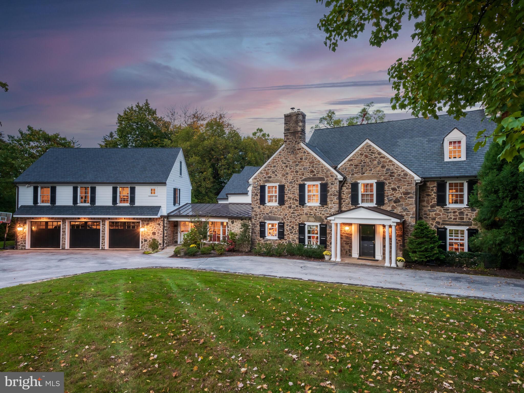 A Philadelphia Main Line Classic like this only comes along once in a generation. As you enter the circular drive, you’ll be welcomed by the easy elegance and understated grace of this special property. Set on just over 2 acres, this is your own private oasis, nestled in the heart of the Main Line. Owned by one family for the last 24 years, this home has been meticulously maintained with a newer roof & major systems, including multi-zoned heating and cooling. A major addition in 2012 added a 3-car, attached oversized garage, with a large gym plus a nanny / in-law suite above. Family living spaces were also updated and expanded, including a convenient mudroom (with built-in storage lockers). An informal "friends and family" side-entry was added offering access to both the front and back yards, the kitchen, family room and informal living areas, as well as the mudroom, garage and Nanny/ In-Law/ Guest suite above. With a floor-plan that meets the needs of today's busy lifestyles, you'll also surprised to find not one - but two private home offices - both located on the second floor of the main house - (away from the noise of family activities). This gracious home effortlessly blends the best of the old and new. The generously proportioned living and dining rooms feature handsome millwork, arched entries, and recessed windows with deep sills. The wood-burning fireplace in the living room provides cozy warmth on winter evenings, while the inviting sunroom beyond offers views of the back yard, bringing beautiful natural light and wonderful open flow for entertaining. The butler's pantry features handsome built-in cabinetry with a wine fridge and pellet ice-maker. With plenty of living spaces to accommodate your needs now and in the future, this spacious home features six (6) bedrooms including a luxury primary suite with a large dressing room and spa-like bath; the In-Law/Nanny/Guest Suite (over the garage); and a 3rd floor bonus room (possible 7th bedroom). Serving these bedrooms, are 5 full baths (including 3 en-suite baths, and a private bath for the In-Law / Nanny Suite), plus a lower level full bath for pool access. All baths have been tastefully updated; several baths have radiant heat flooring. The farm-house style kitchen features a commercial grade range, full-size Sub-Zero refrigerator and separate full-size Sub-Zero freezer, a center island that comfortably seats six, warming drawer, coffee bar, and generous pantry storage. The adjacent breakfast room is open to the family room - the perfect place to put your feet up and relax with a fireplace, and two cozy reading nooks. The family room features a convenient "homework area" with built-in shelving, two desks and printer cabinet, as well as access to the stunning 3-season screened porch, overlooking the pool and yard. The addition above the garage features separately zoned HVAC and hot water. This space includes the Nanny/ Guest/ In-Law Suite (queen sized bedroom with full bath) and a kitchenette (with apartment size fridge/ freezer, sink and dishwasher). There is a large home Gym (TRX, yoga silks and weight equipment can be included), and a fun TV/ movie/ gaming loft. This amazing recreation space could also be purposed for a golf simulator or movie / screening room. The partially finished basement includes a casual recreation space (with plenty of storage closets for games and toys), a full bath with an oversized shower (great for pool access), and even stackable laundry (for pool towels). Taking advantage of the magnificent and private setting, outdoor living spaces include a beautiful screened porch (with un-interrupted view screens), elegant stone patios and terraces, a putting green, and a gorgeous heated pool with a seating area and a wisteria-covered pergola. Pre-Listing Home, Pool and Chimney Inspection Reports are available. Showings by appointment only.