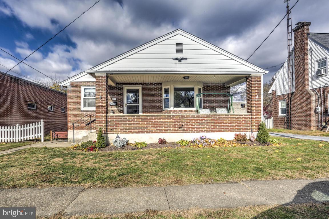 This home truly represents the pride of home ownership. One floor living conveniently located on a quiet street. High end quality repairs have been made throughout this home. New 3-pane replacement windows, central air, and a new energy efficient natural gas furnace with a separate zone for the basement. Beautiful oak floors throughout and a tile backsplash in the kitchen. The basement features a wood burning fireplace
