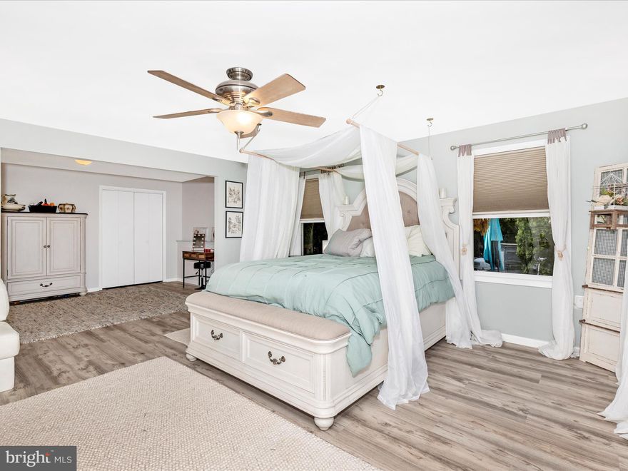 Welcome to this meticulously maintained and thoughtfully 80K upgraded 3-bedroom, 3-bath home in the sought-after View More Heights community. Nestled on a quiet cul-de-sac and set on nearly a full acre, this property is a rare blend of comfort, convenience, and luxury—inside and out.

From the moment you arrive, the landscaped front walk and inviting porch draw you in. Enter through the front door or via the versatile side entry, which opens into a spacious flex area—perfect for a home office, rec room, or home gym.  With 2 closets in this room it could potentially serve as a 4th bedroom (2nd bed on main level). Here, you'll also find a large laundry/mudroom with ample built-in storage, a mechanical room, and a main-level bedroom and full bath, offering convenient, step-free living.

Upstairs, vaulted ceilings and natural light flood the main living area. The open-concept layout connects the living and dining spaces to the kitchen, which is centrally located for entertaining. Featuring new, app-ready smart appliances and piped for future gas conversion, the kitchen flows into a cozy family room through a convenient pass-through window.

Step out to the screened-in deck and take in views of your own backyard oasis—lush, fully fenced, and complete with mature landscaping, garden paths, and a fiberglass in-ground saltwater pool. Two redesigned pergolas and expansive concrete deck make this the ideal space for relaxing or entertaining in style.

The primary suite is a tranquil escape, featuring a fully renovated spa-style bathroom, walk-in closet, serene sitting area, and a brand-new sliding glass door to a private patio—perfect for peaceful mornings or winding down at sunset.

Additional Features & Upgrades Include: whole-house luxury vinyl plank (LVP) flooring, ceiling fans throughout for comfort and airflow, fresh, whole-house interior paint, new water softener, UV purification, and full-house filtration system, saltwater pool conversion for low-maintenance and healthy living, reinforced deck joists, new recessed lighting in the family room and more.  Luxury meets security with cameras on property for pool and house safety, and property includes detached oversized garage with pull-down, lit attic storage, separate garden/storage shed for tools and equipment, and ample driveway space provides parking for multiple vehicles—perfect for gatherings or guests.

And best of all—no HOA restrictions. Enjoy the freedom to live how you choose in a home that truly supports it all.

With mountain and garden views, an ideal layout, and every upgrade already complete, this home offers the perfect balance of peaceful privacy and practical convenience. Just minutes to commuter routes, top-rated schools, and vibrant downtown Frederick.

Don’t miss your opportunity to own this one-of-a-kind, fully upgraded retreat—schedule your tour today!