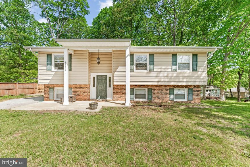 This charming updated 4-bedroom, 2.5-bath split-level home is located on a quiet cul-de-sac close to PAX River NAS. Step inside to a spacious, open-concept kitchen featuring ample cabinet storage, brand-new quartz countertops ideal for meal prep, and sleek stainless steel appliances. The kitchen flows effortlessly into the dining and living areas, creating a warm and inviting space perfect for family time or entertaining guests. Down the hall, you'll find three generously sized bedrooms, a full bath, and a spacious primary suite offering an ensuite bath and peaceful views. Both upstairs bathrooms have also been upgraded with Quartz Countertops! The lower level boasts a large rec room ideal for movie nights or game days, plus additional space that can be used for a home gym or game table. You’ll also find a dedicated workshop, a fourth bedroom, a half bath, and a laundry area. Outside, enjoy evenings around the fire pit on a flat lot that’s ready for your landscaping vision. All of this just a 4-minute drive or 15-minute walk to base, and close to shopping and restaurants. Don’t miss your chance—schedule your showing today!