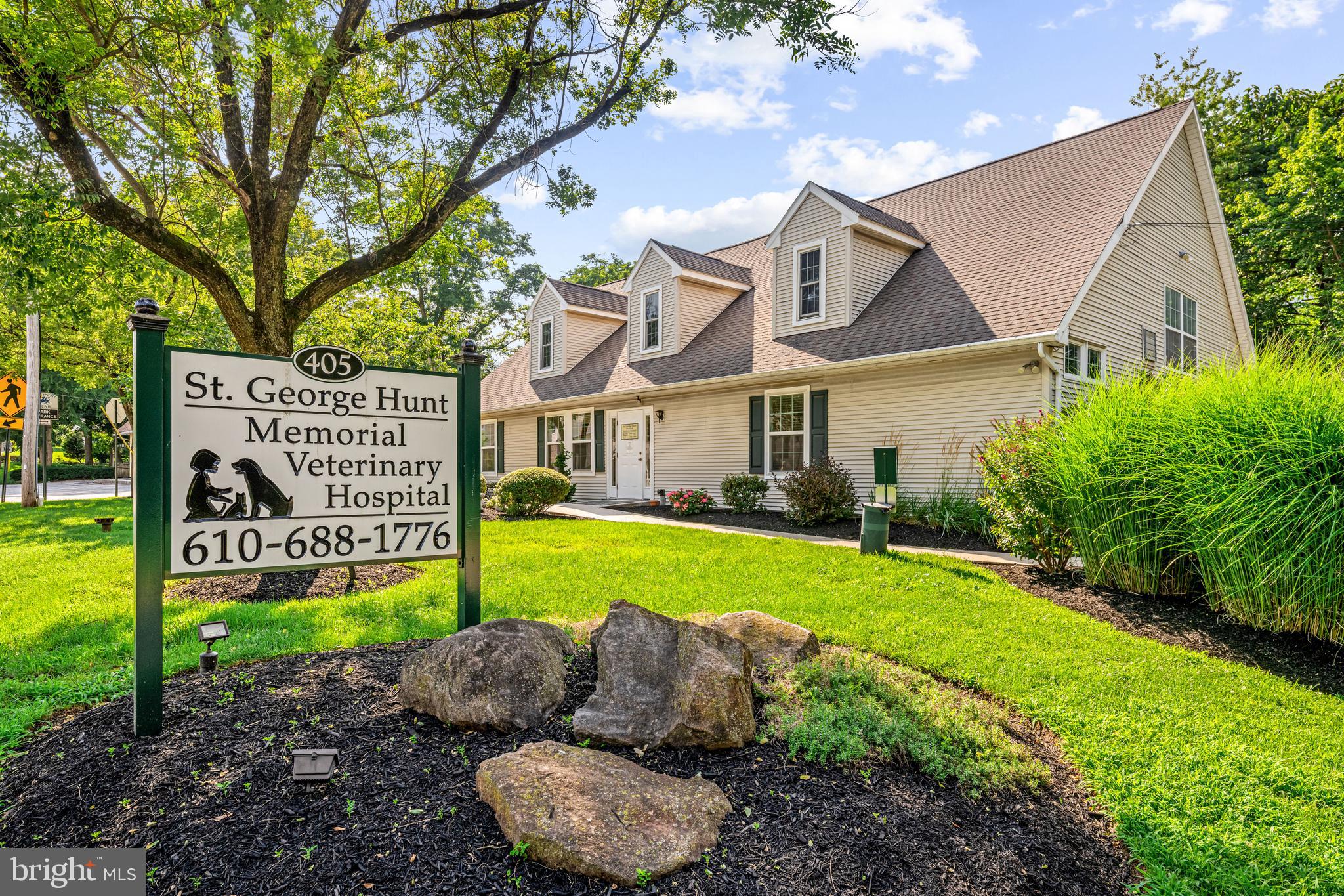 Located on a bustling, high-visibility street with steady foot and vehicle traffic, this 3,820-square-foot freestanding office—complete with two-bedroom, 1,330-square foot apartment—offers a premier suburban location in the thriving Main Line town of Wayne, where the average household income exceeds $160,000. Currently operating as a full-service veterinary practice and animal hospital, this well-appointed facility is thoughtfully designed for seamless, efficient workflow with space to accommodate multiple doctors, technicians and support staff, plus advanced diagnostic, surgical and wellness services. Outside, the building’s tidy grounds include mature trees and plantings and a sidewalk-lined street that backs to protected township greenspace and an access point to the popular Radnor Trail—a perk for both staff and clients. Inside, the main level features a bright, welcoming lobby and reception area with ample seating, four spacious exam rooms, a dedicated X-ray room, half bath and kennel area. A 1,300-square-foot surgical suite provides generous space for procedures, observation, storage and advanced equipment, while a central vacuum system ensures optimal air quality. The second level houses a private two-bedroom apartment with separate entrance that’s ideal for leasing, employee housing or additional office space. The apartment boasts a fully equipped kitchen with ample cabinetry and peninsula seating, a central family room, two bedrooms, a full hall bath and direct access to parking. The unfinished lower level with newer egress well offers flexible options for extra storage or workspace, while the surrounding parking lot includes nine dedicated spaces (two for the apartment and seven for clients and staff). Located just ten miles from Philadelphia city limits, this well-maintained property is a rare find—perfect for another veterinary practice (select equipment available for purchase) or readily adaptable for professional offices, medical services or other commercial uses.