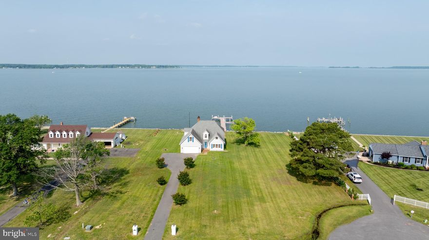 Welcome to this charming waterfront property offering breathtaking Westerly views.  Sunsets abound and create a colorful backdrop of the Choptank River.  As you enter, you're greeted by an airy two-story foyer that flows seamlessly into a spacious family room, where expansive windows frame picturesque sunsets over the water. The main-level primary suite features serene water views, providing a peaceful retreat at the end of the day. Step outside to a waterside brick patio and walk out to your private pier—perfect for enjoying the tranquil setting and vibrant sunsets. With ample-sized bedrooms, a two-car attached garage,  this home combines comfort, functionality, and the best of waterfront living.