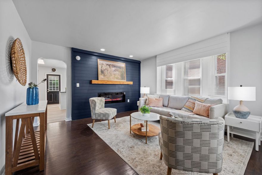 Located in the convenient Aigburth section of Towson, this sunny, updated end-of-group townhouse offers 3 bedrooms and 2 full baths and is sure to impress. A spacious covered front porch overlooking mature landscaping welcomes you home.

Step inside to a bright and inviting living room featuring an electric fireplace set into a stylish shiplap accent wall painted in a beautiful marine blue. A bay window overlooking the side yard fills the space with natural light. The living room flows seamlessly into the newly renovated open-concept kitchen and dining area, complete with all appliances to make cooking a breeze. A large center island provides ample workspace, while Shaker-style cabinets offer generous storage and granite countertops ensure easy cleanup.

Upstairs, you’ll find three spacious bedrooms and an updated hall bath. Low-maintenance laminate flooring throughout adds both style and practicality. Mini-split systems provide year-round comfort, while the gas boiler ensures cozy warmth during colder months.

The finished lower level offers additional living space, a second full bath with stall shower, a summer kitchen, and direct access via back basement stairs—ideal for guests or flexible living arrangements.

Just off the kitchen, a large covered verandah creates the perfect outdoor gathering space. A parking pad accessed through a wide alley ensures easy and convenient parking.

Located on quiet Ridge Avenue, this charming home is within easy walking distance to Towson University, Whole Foods, and Towson’s many restaurants, shops, and amenities.