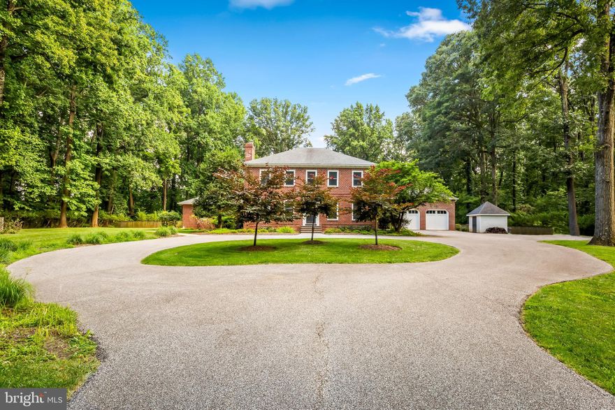 Discover seclusion just minutes from local hospitals, schools, Hunt Valley and downtown. 1500 Broadway is a magnificent brick colonial finely sited on a level lot down a tree-lined private driveway off  Berans Road. Everything you'll need for the next 50 years is here: in-law suite in the main level (or make it the primary bedroom later on), level yard perfect for adding a pool, 6 bedrooms and 5 full baths plus a main level half bath, multiple family rooms and more. Updated and expanded primary suite with recent bath remodel adding outstanding modern conveniences. Recent full bath added to bedroom two, complete with marble accents. So much space makes this THE house for gatherings. Two lower level family rooms plus additional space for bedroom 6 and a full bath.  Main floor den or office plus family room with separate entrance, vaulted ceiling and bar area. Renovated, updated kitchen with Wolf and SubZero appliances. Mud room connects kitchen to garage. And the garage is plumbed and ready for an apartment above with some duct work in place for hvac system. Come enjoy the tranquility. You'll never want to leave.