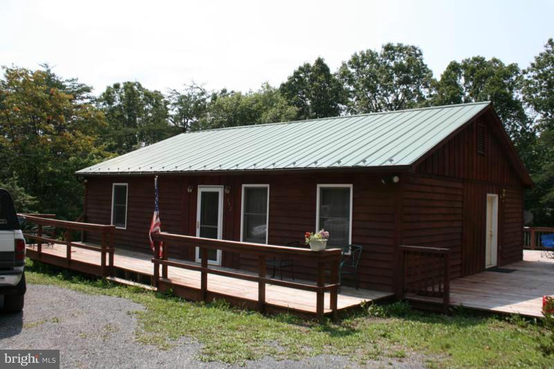 A quality built home close to the Fred Co VA line w/ very few restrictions. Giant deck as big as the house! Stainless steel appliances, lots of space in beautiful cherry cabinets, hardwood floors, seamless gutters, RainSoft water treatment system,invisible fence system w/ 2 collars, 2 ext. sheds (one shed w/ electric service). Wild berry patch, plenty of dogwood trees, and more!