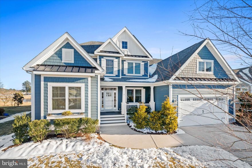 Welcome to privacy, seclusion, and peace found at 24474 Brookstone Path—a beautifully designed 4-bedroom, 3-bath home offering the perfect balance of luxury, comfort, and lifestyle. Nestled off the 16th golf hole in the sought-after, amenity-rich community of The Peninsula, this expanded Whimbrel model is tucked away on a quiet cul-de-sac and showcases the potential for first-floor living with plenty of space to entertain and enjoy year-round. From the moment you enter, you’re greeted by abundant natural light and an open floor plan that flows effortlessly from room to room. The great room makes a striking first impression with its soaring two-story cathedral ceiling, slate gas fireplace flanked by custom built-ins, and a stunning wall of stacked picture windows with transoms—perfectly framing serene pond and golf course views. The gourmet kitchen is both stylish and functional, featuring custom white soft-close cabinetry with crown molding, neutral granite countertops, a classic subway glass tile backsplash, stainless steel appliances, a center island, large breakfast bar, oversized pantry, and a generously sized laundry room with custom cabinetry conveniently located just off the kitchen. The primary suite is a true retreat, offering a tray ceiling, two spacious walk-in closets, a box bay window with peaceful pond views, and an ensuite bath fit for royalty with an oversized walk-in shower. Two additional first-floor guest bedrooms provide comfort and convenience for family and friends, while a private office with elegant glass doors and a full bath completes the main level. Upstairs, a loft offers a cozy space for reading, puzzles, or quiet relaxation, along with a spacious bedroom, a full bath with tub, and a large unfinished storage room—an uncommon feature that provides great storage. Additional highlights include new Hardi Plank siding (2023), owned solar panels which assist immensely with the utility cost, an oversized two-car garage with a brand-new epoxy floor (2026), and a favorite gathering space: the enclosed, year-round sunroom with spectacular views and access to a Trex porch—ideal for outdoor entertaining and peaceful moments surrounded by nature. Beyond the home, this area within The Peninsula offers larger lot sizes for a more open, less congested feel. Brookstone Path is a quiet cul-de-sac with limited traffic, enhancing the sense of privacy and tranquility. Residents enjoy world-class amenities including Jack Nicklaus Signature Golf, indoor and outdoor pools, fitness and sports facilities, bayfront beach access, and endless opportunities to embrace the best of coastal living. This home offers the first right of refusal to purchase a reserve membership.