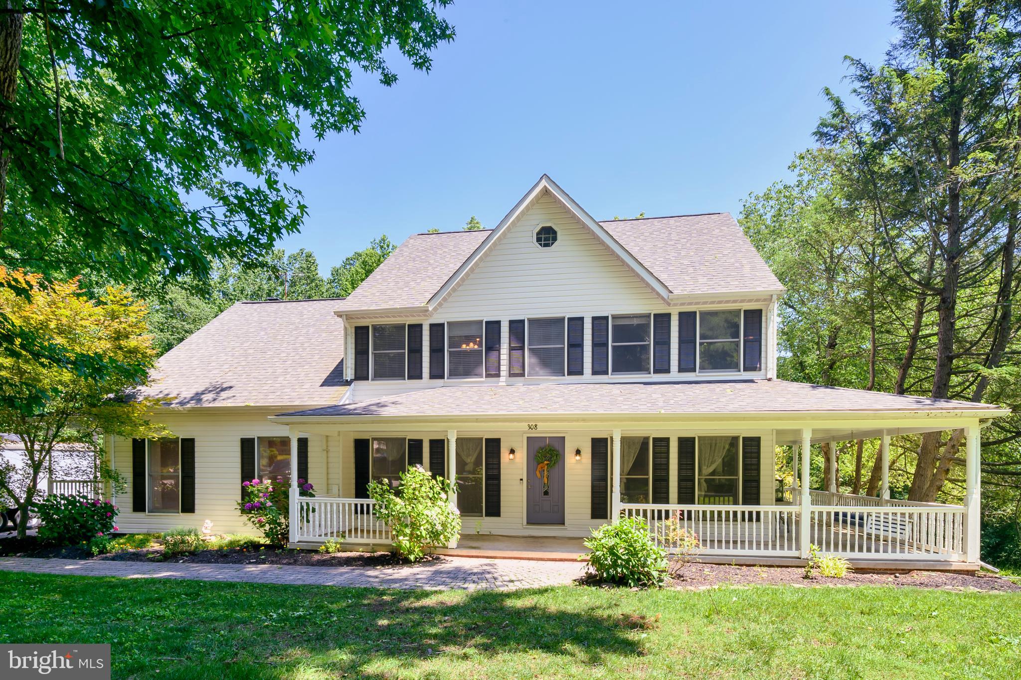Private, spacious, and full of heart—welcome to Queen Anne Estates! Nestled on 5.1 peaceful acres, this one-of-a-kind home offers country living just 17 miles from the U.S. Capitol, with easy access to Baltimore and Annapolis. At this time of the year, we should probably start by focusing on the gorgeous inground pool surrounded by nature for privacy and relaxation. Whether hosting summer gatherings or enjoying a quiet morning swim, this backyard retreat is a standout feature. Inside, the main level offers gorgeous hardwoods, custom moldings, a formal living room, large dining area, and a family room with brick wood-burning fireplace —all flowing beautifully onto the deck overlooking the pool and woods. This home also offers a main-level in-law suite including its own private entrance, kitchenette (fridge, sink, cabinets, convection oven), and handicap-accessible full bath—ideal for multigenerational living or guests. Upstairs, the spacious primary suite boasts a sitting area, bath with jetted tub, and walk-in shower, plus three additional bedrooms and another full bath. The partially finished walkout basement features a workshop and another full bath, filled with potential for what you might want it to become. Property has a 12x36 storage shed as well. The 8 foot deep wrap around front porch will welcome you and all of the remaining unique features will invite you to call this place home.