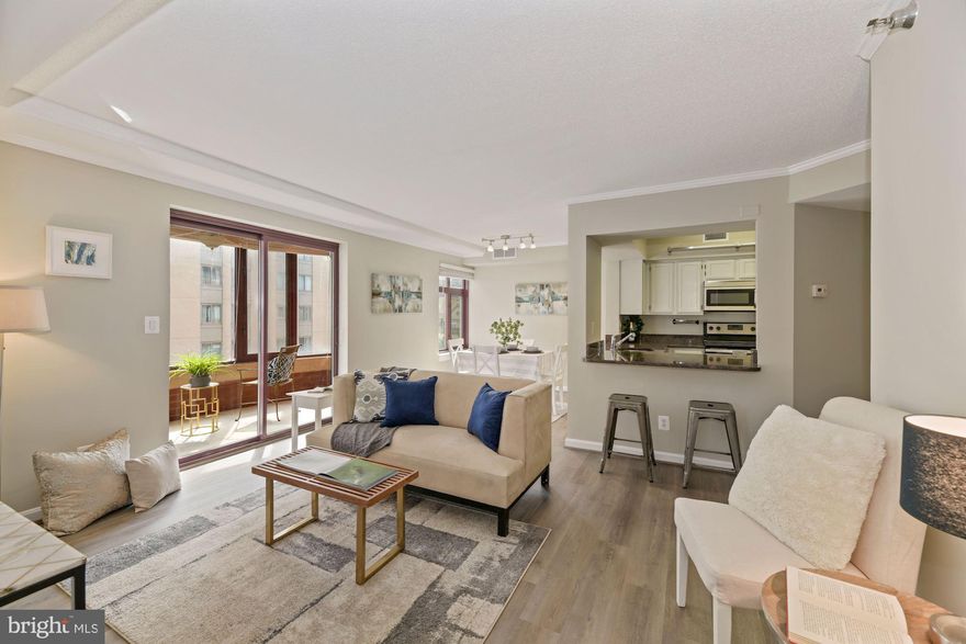 Fabulous Price Adjustment!! Location, location, location! Unit 505 in The Charleston is situated in the heart of bustling Clarendon, just minutes from dozens of popular restaurants and shops.  This two bedroom, two bathroom corner unit features a large, enclosed balcony, perfect as a sunroom, with enormous windows offering the ability to enjoy a pleasant regardless of season.  The large kitchen has stainless steel appliances, granite countertops and attractive gray cabinetry.  The open living area is generously sized, allowing for a separate dining area. The spacious primary bedroom boasts a walk-in closet and en-suite bath, as well as access to the in-unit laundry.  The second bedroom has plentiful natural light from two large windows and is adjacent to the second full bath.  The unit comes with assigned storage unit and garage parking space.  Great value in a prime location!